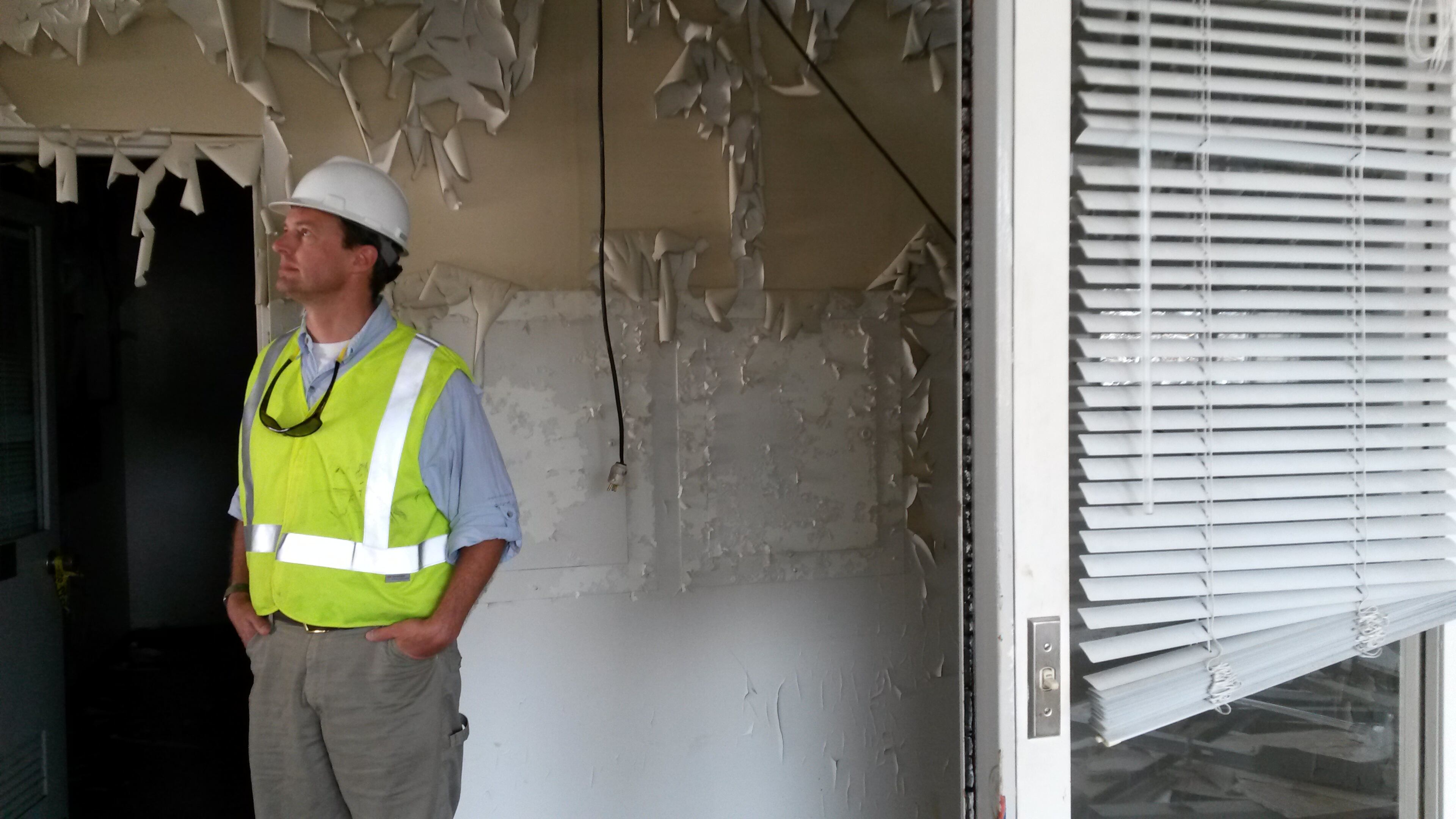 Initially, site manager Jimmy Penson needed a flashlight to find his way around inside the vacant buildings on the site of the former GM assembly plant in Doraville. Now, light streams into a partially demolished wing of the former administration building. MATT KEMPNER / AJC