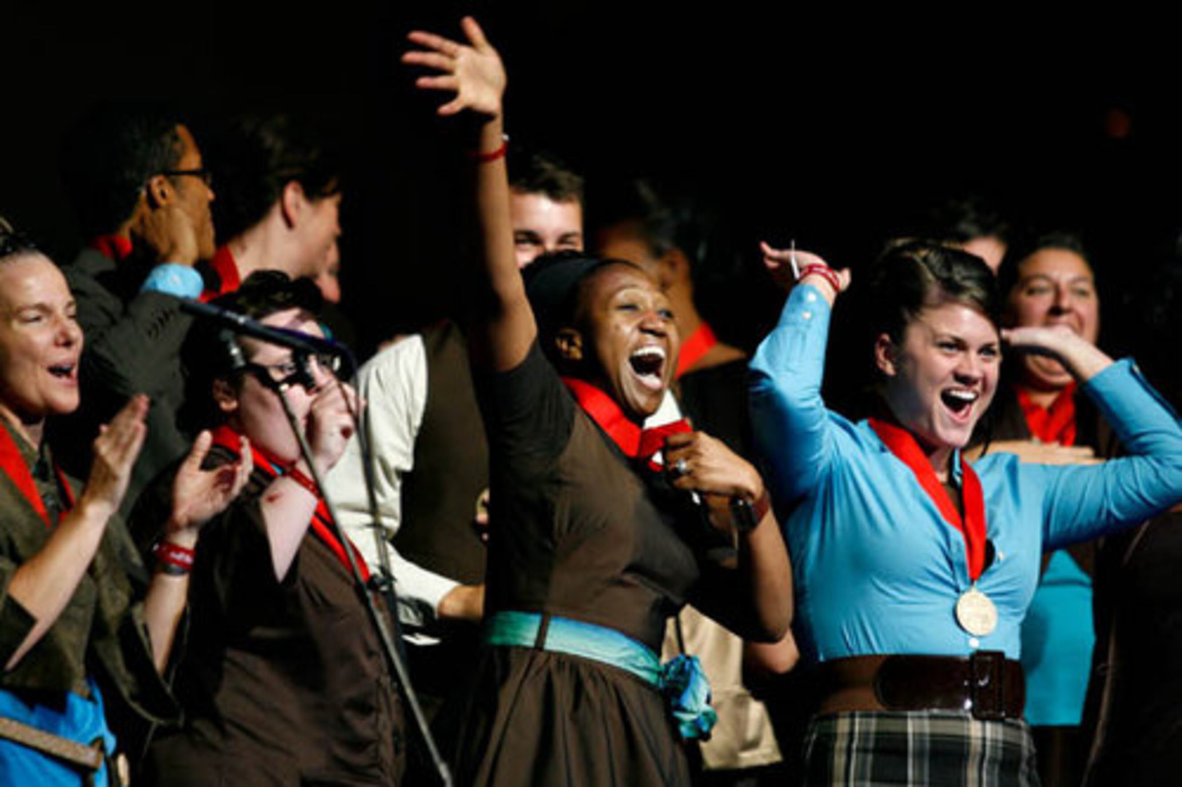 Nadine O'Brien, center, celebrates as the Atlanta West Pentecostal Church choir is announced as the winner. The choir received $15,000 and moves on to the national competition and win the title of America's best church choir.