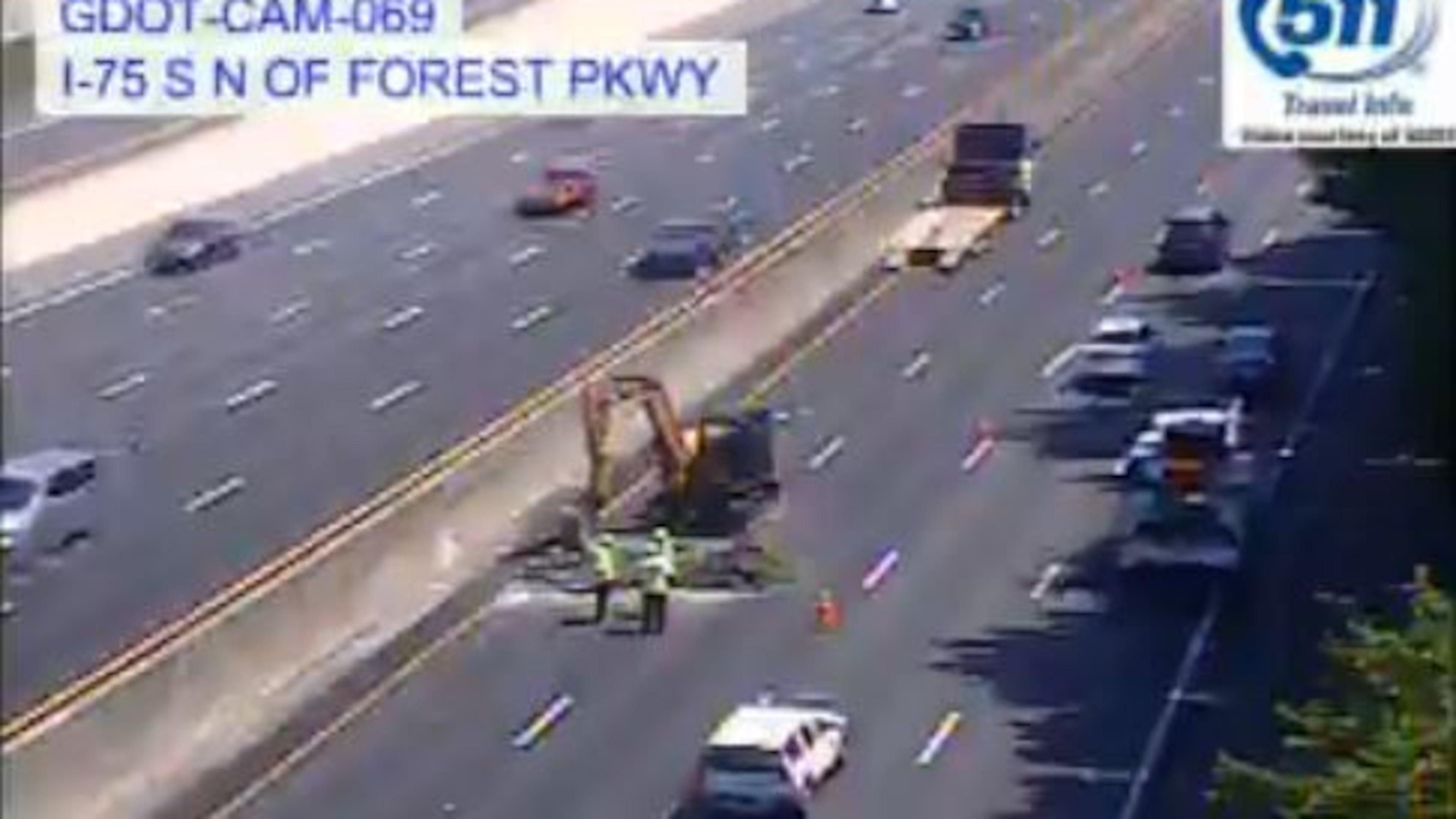 A pothole on I-75 South in Clayton County caused delays through Tuesday morning. (Credit: Georgia Department of Transportation)