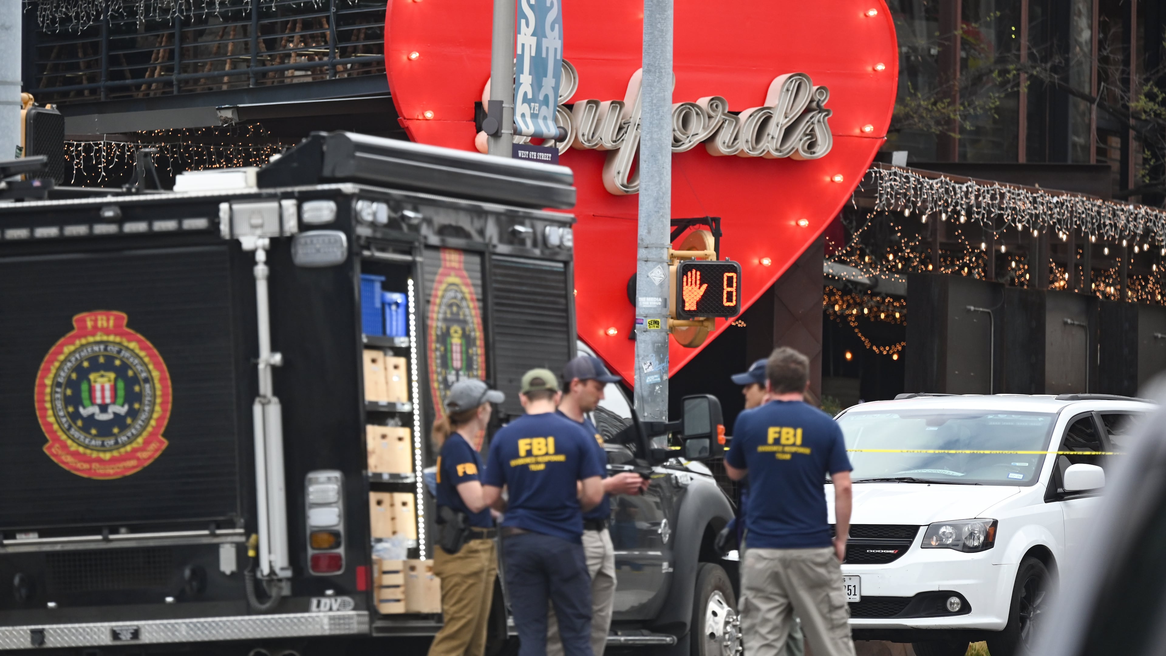 The Austin Police Department and the FBI investigate a shooting at Buford's on 6th Street on Sunday, March 1, 2026, in Austin, Texas. (AP Photo/Jack Myer)