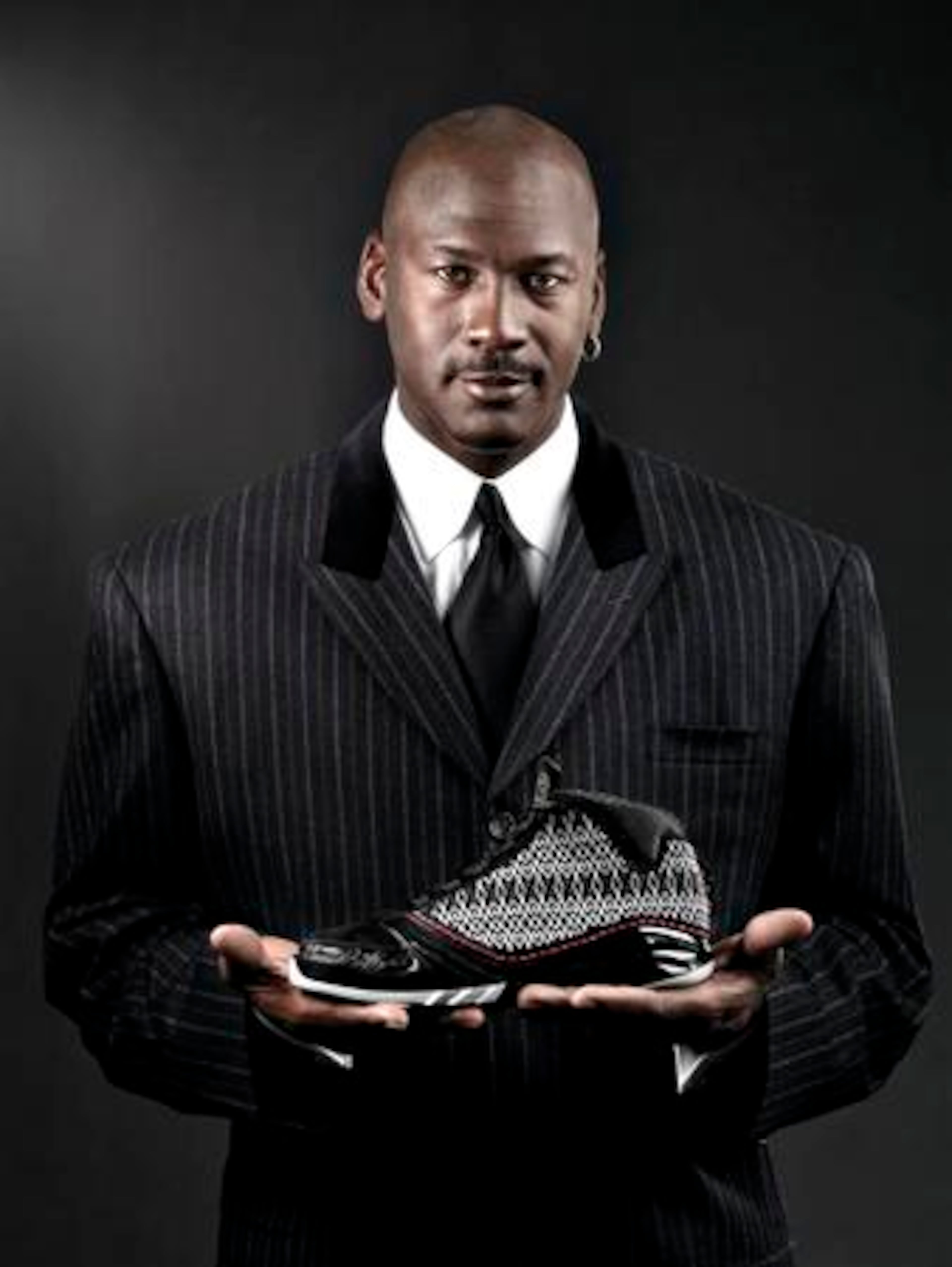 In a photo released by Nike Inc., Michael Jordan poses with the new Air Jordan XX3 basketball shoe. The Air Jordan XX3 will be released in three hyped-up rounds from January to February, starting with a limited edition to be sent to only 23 retailers to be sold for $230 and concluding with the national launch at $185.