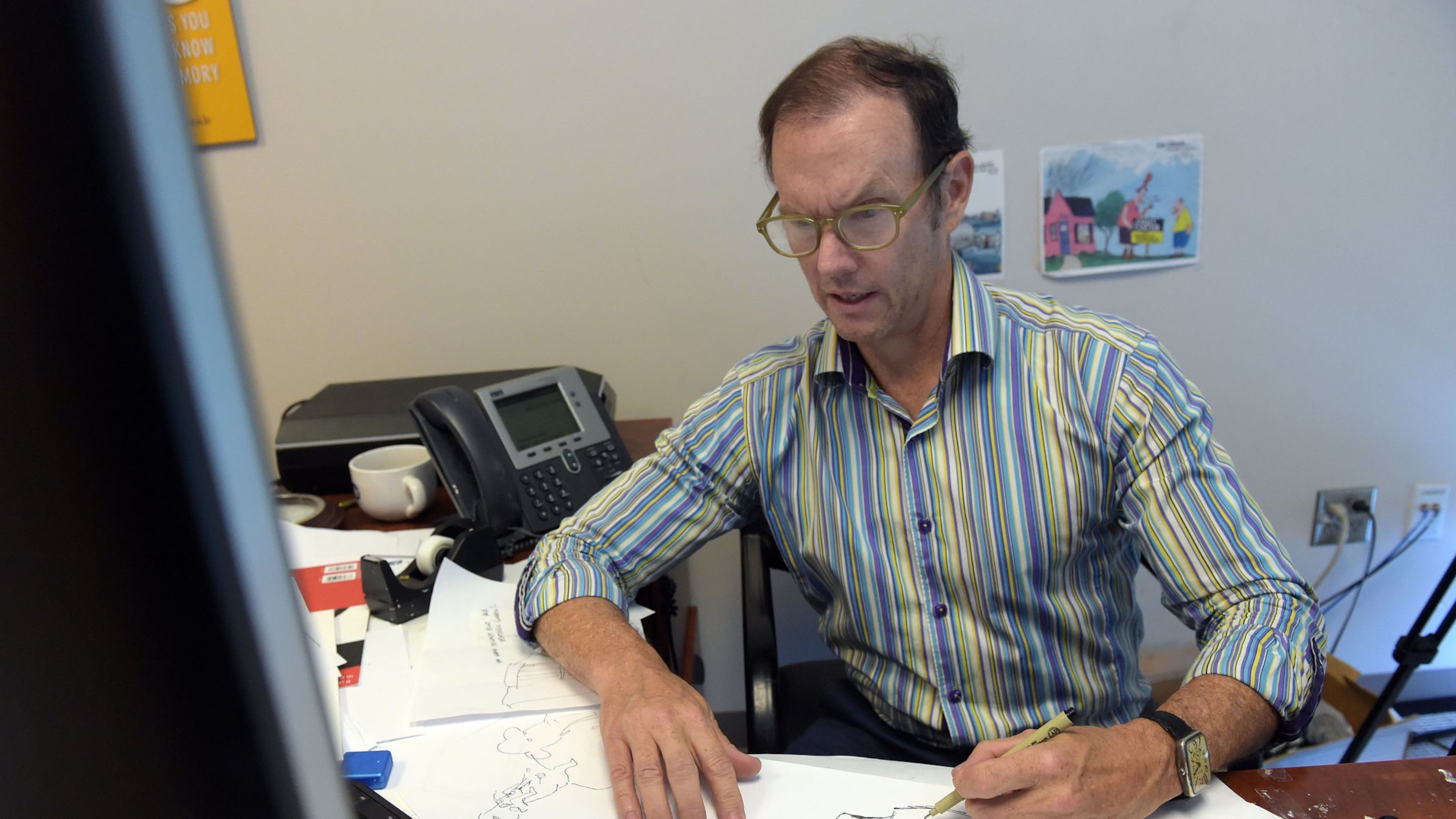 Atlanta Journal-Constitution editorial cartoonist Mike Luckovich told "Politically Georgia's" Bill Night that his goal is to "come up with something that shows people what’s actually happening or helps people in some way, stands up for people who don’t have much of a voice.” AJC FILE PHOTO 2017