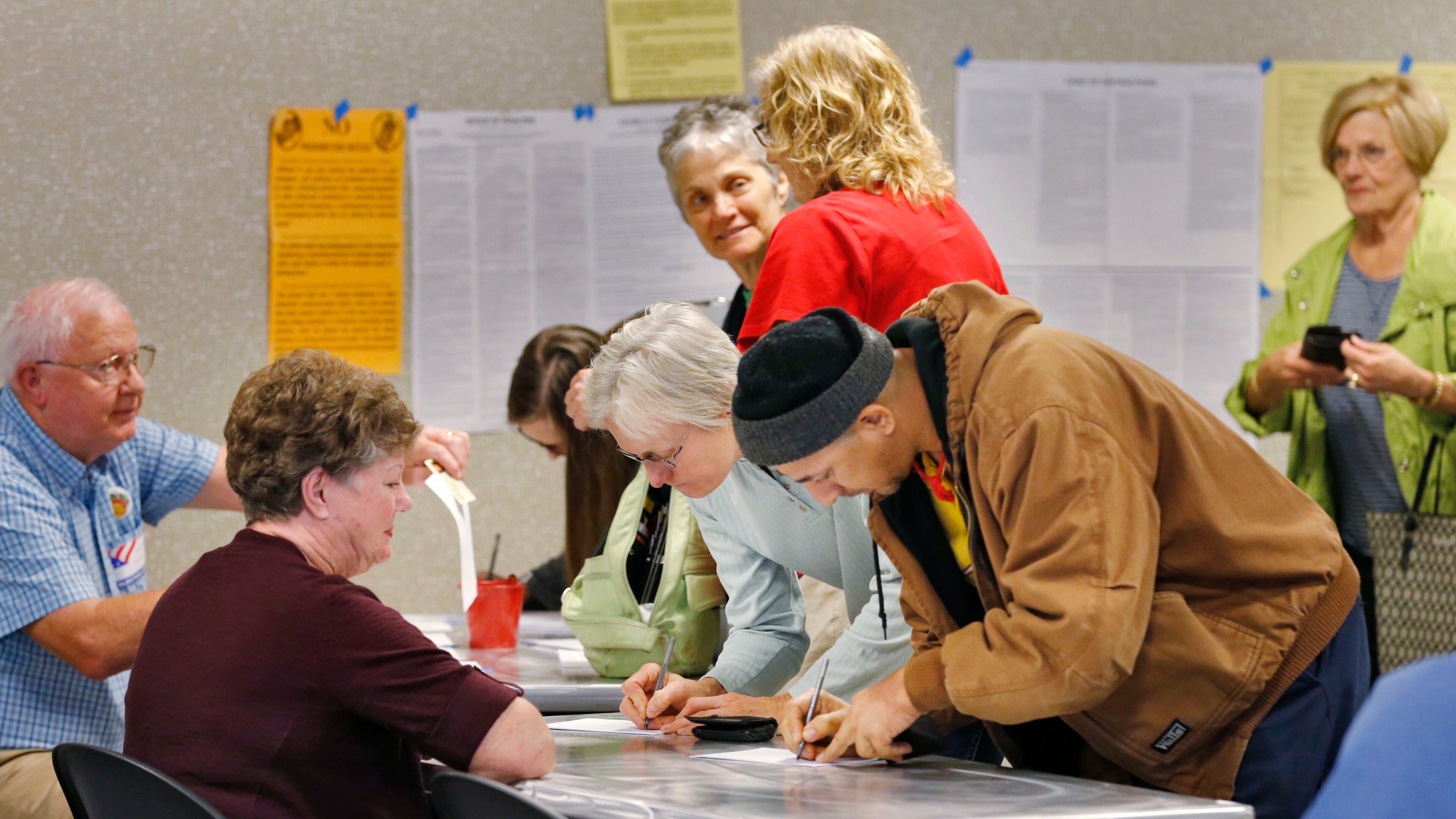 Nov. 3, 2015 - DeKalb County - Voters sign in at the Tucker Library, where city hood for Tucker was on the ballot. In DeKalb County residents could vote on an ethics overhaul for the county and city hood for LaVista Hills and Tucker. Hawthorne Elementary is one of the busiest precincts in DeKalb, where voters will consider overhauling the county's ethics rules and city hood for LaVista Hills. BOB ANDRES / BANDRES@AJC.COM