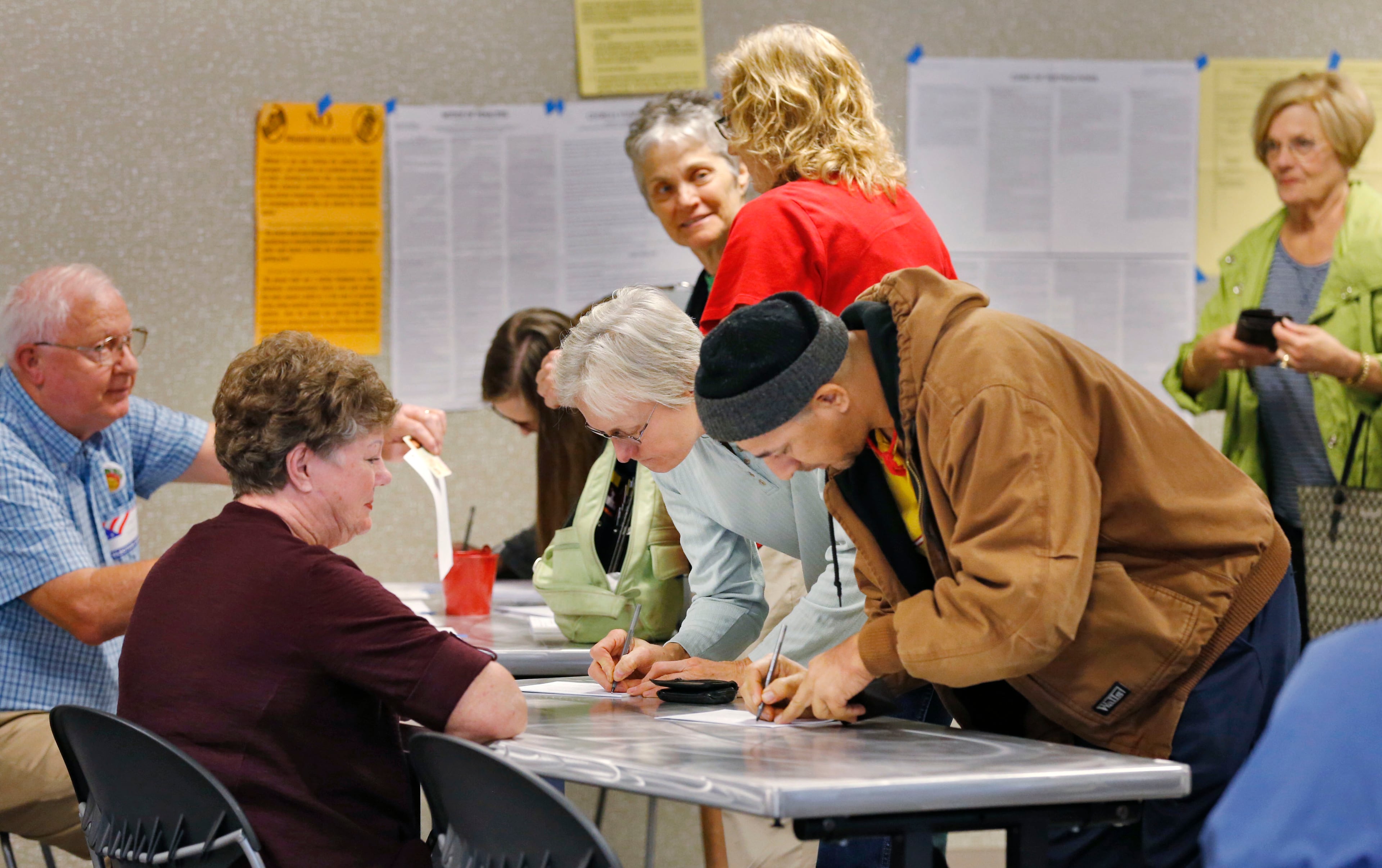 Nov. 3, 2015 - DeKalb County - Voters sign in at the Tucker Library, where city hood for Tucker was on the ballot. In DeKalb County residents could vote on an ethics overhaul for the county and city hood for LaVista Hills and Tucker. Hawthorne Elementary is one of the busiest precincts in DeKalb, where voters will consider overhauling the county's ethics rules and city hood for LaVista Hills. BOB ANDRES / BANDRES@AJC.COM