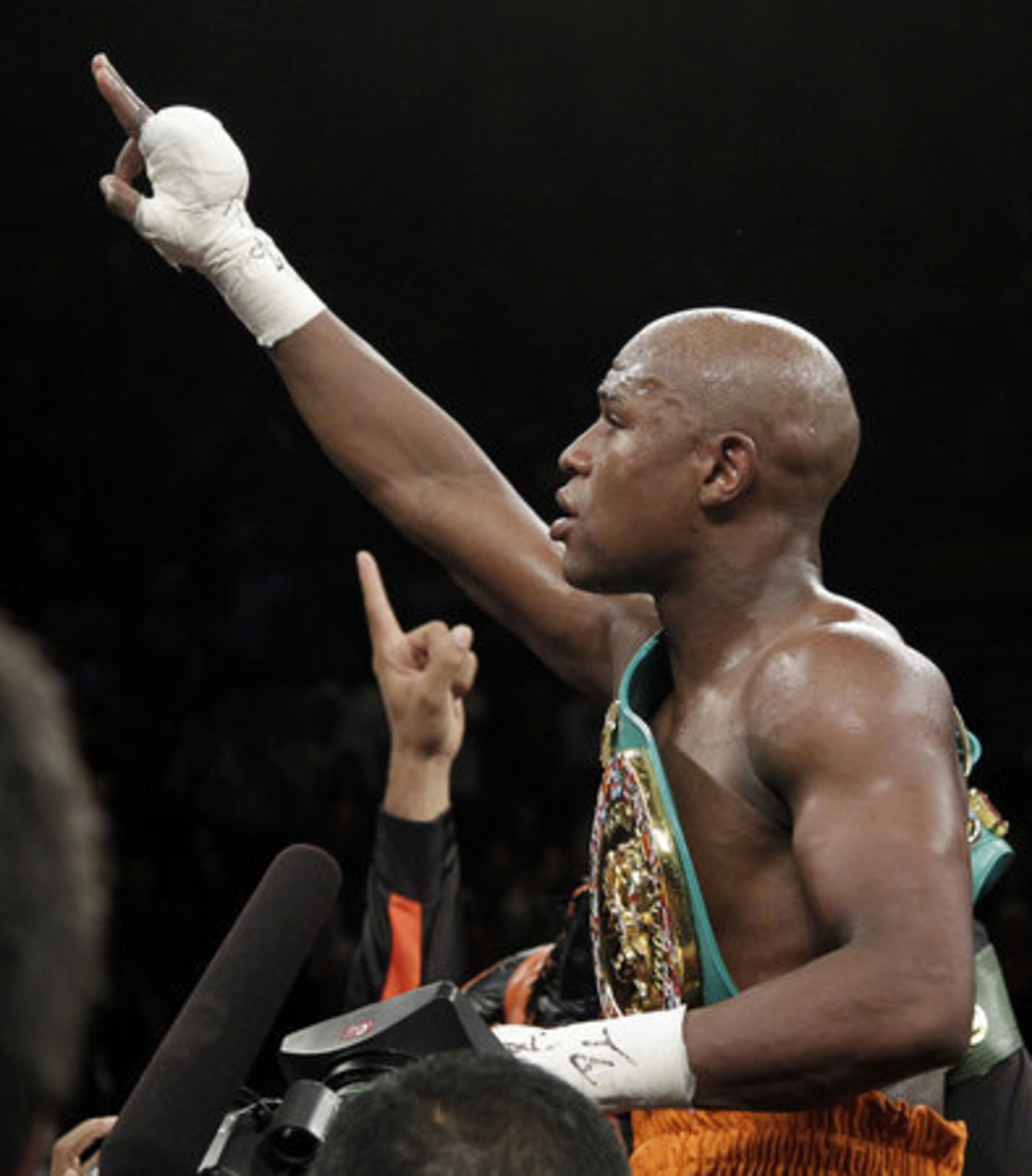Floyd Mayweather Jr. celebrates after knocking out Victor Ortiz Floyd during their WBC welterweight title fight Saturday, Sept. 17, 2011, in Las Vegas. The bout's controversial ending had boxing fans buzzing.
