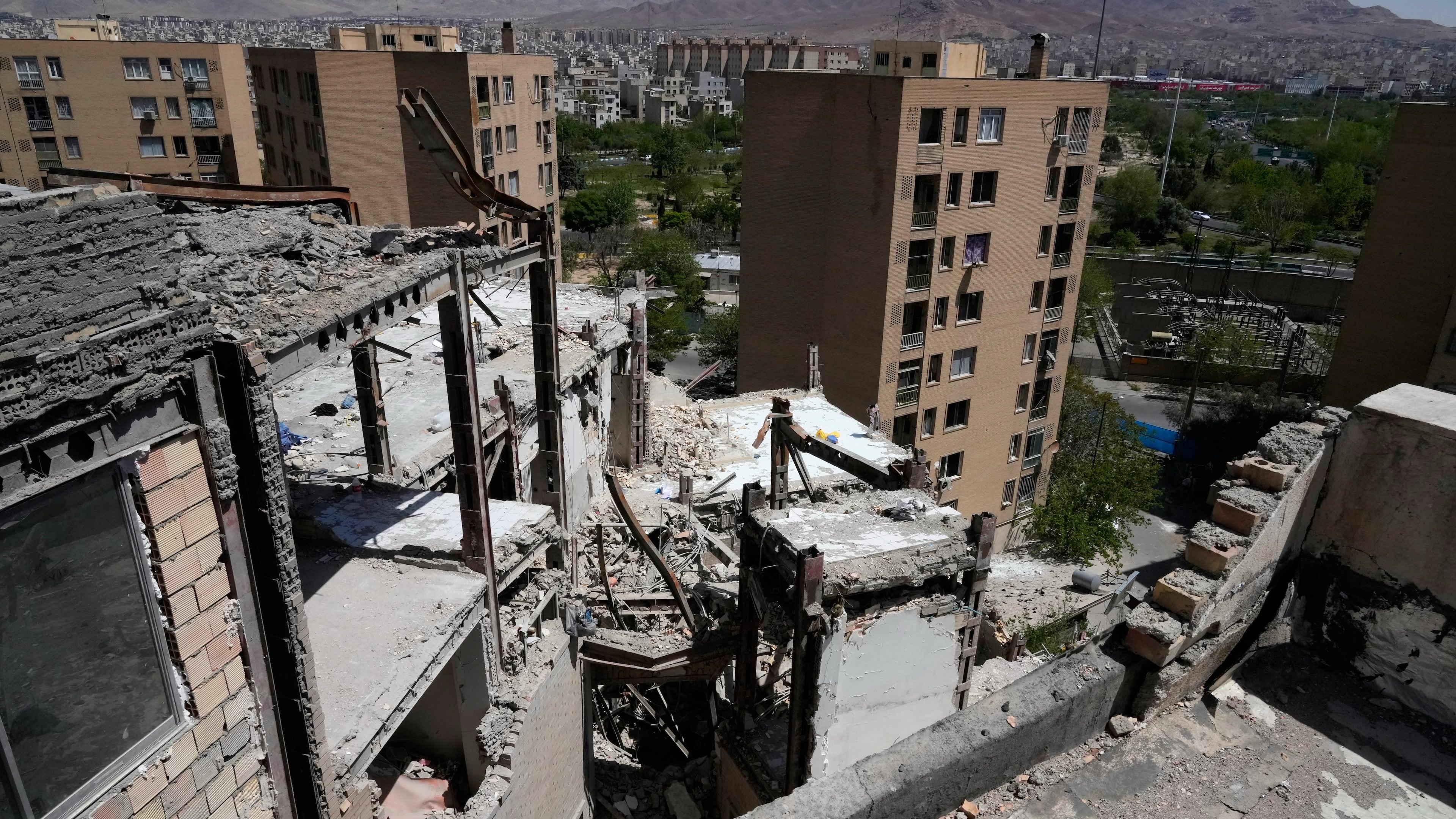 Damage is visible on a residential building that, according to Iranian authorities, was hit by a strike on March 4 during the U.S.-Israeli military campaign, in southeastern Tehran, Iran, Tuesday, April 14, 2026. (AP Photo/Vahid Salemi)