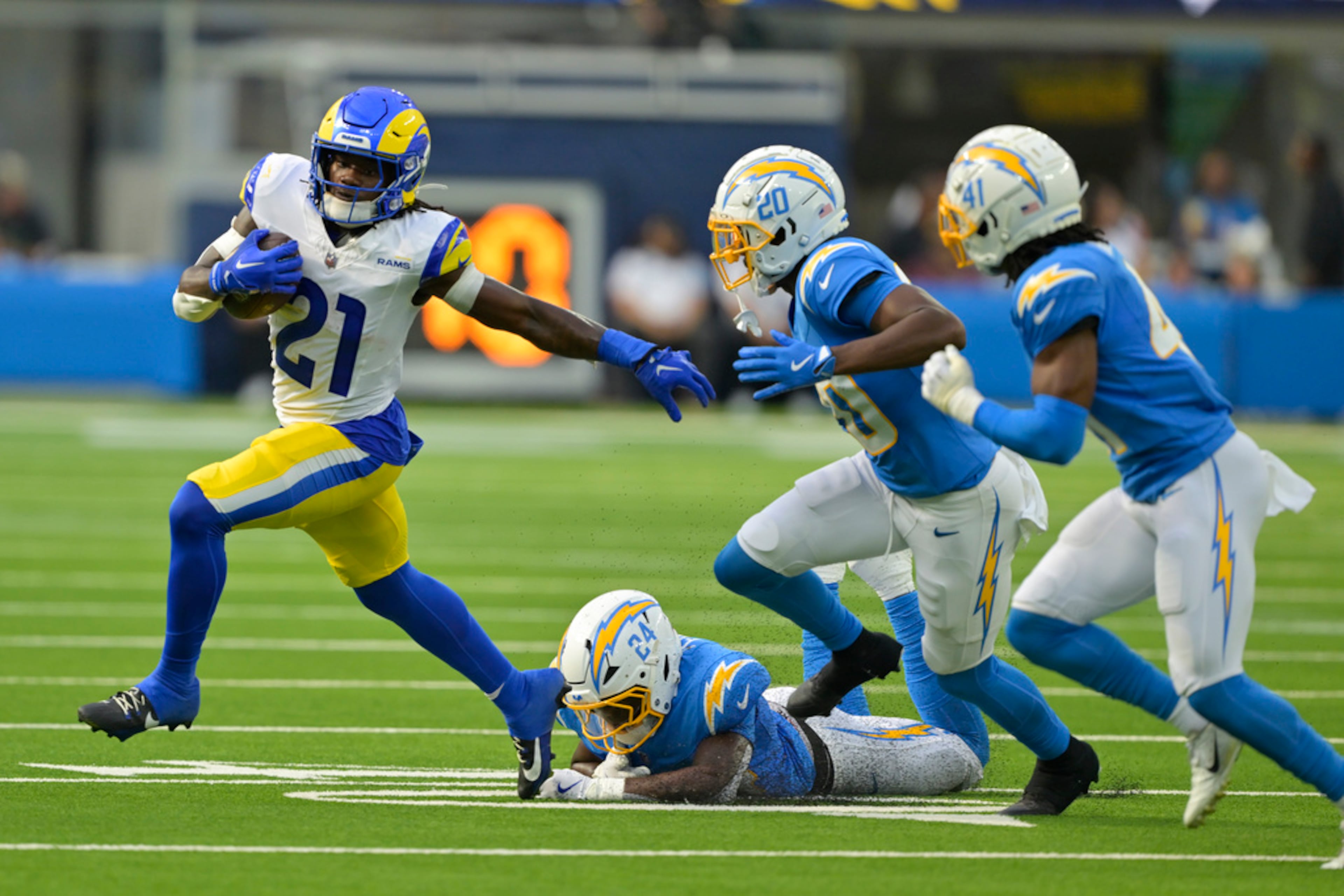 Los Angeles Rams running back Zach Evans (21) carries during the first half of a preseason NFL football game against the Los Angeles Chargers, Saturday, Aug. 17, 2024, in Inglewood, Calif. (AP Photo/Jayne Kamin-Oncea)