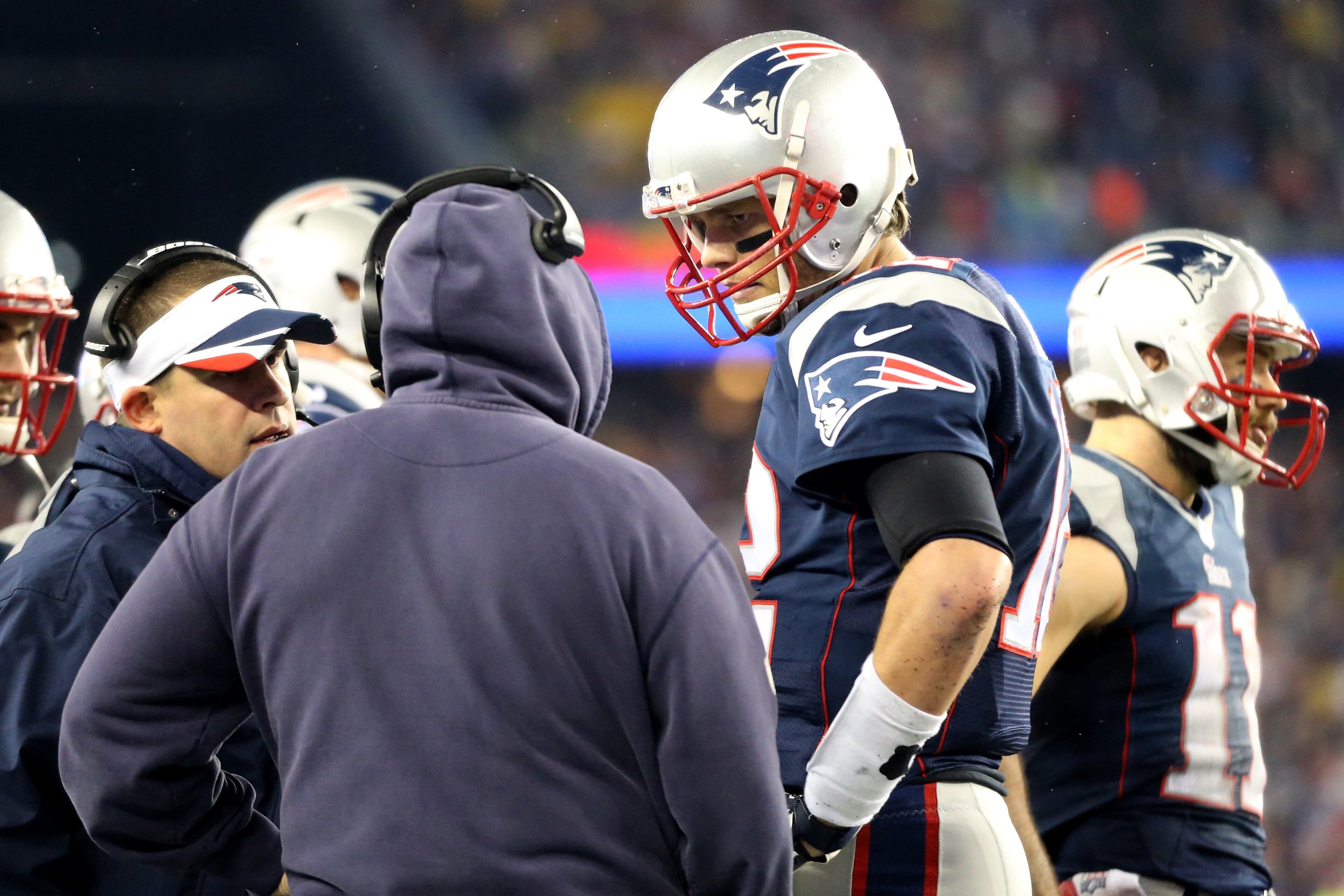 FOXBORO, MA - JANUARY 18: Tom Brady #12 of the New England Patriots talks to head coach Bill Belichick in the first half against the Indianapolis Colts of the 2015 AFC Championship Game at Gillette Stadium on January 18, 2015 in Foxboro, Massachusetts. (Photo by Jim Rogash/Getty Images)