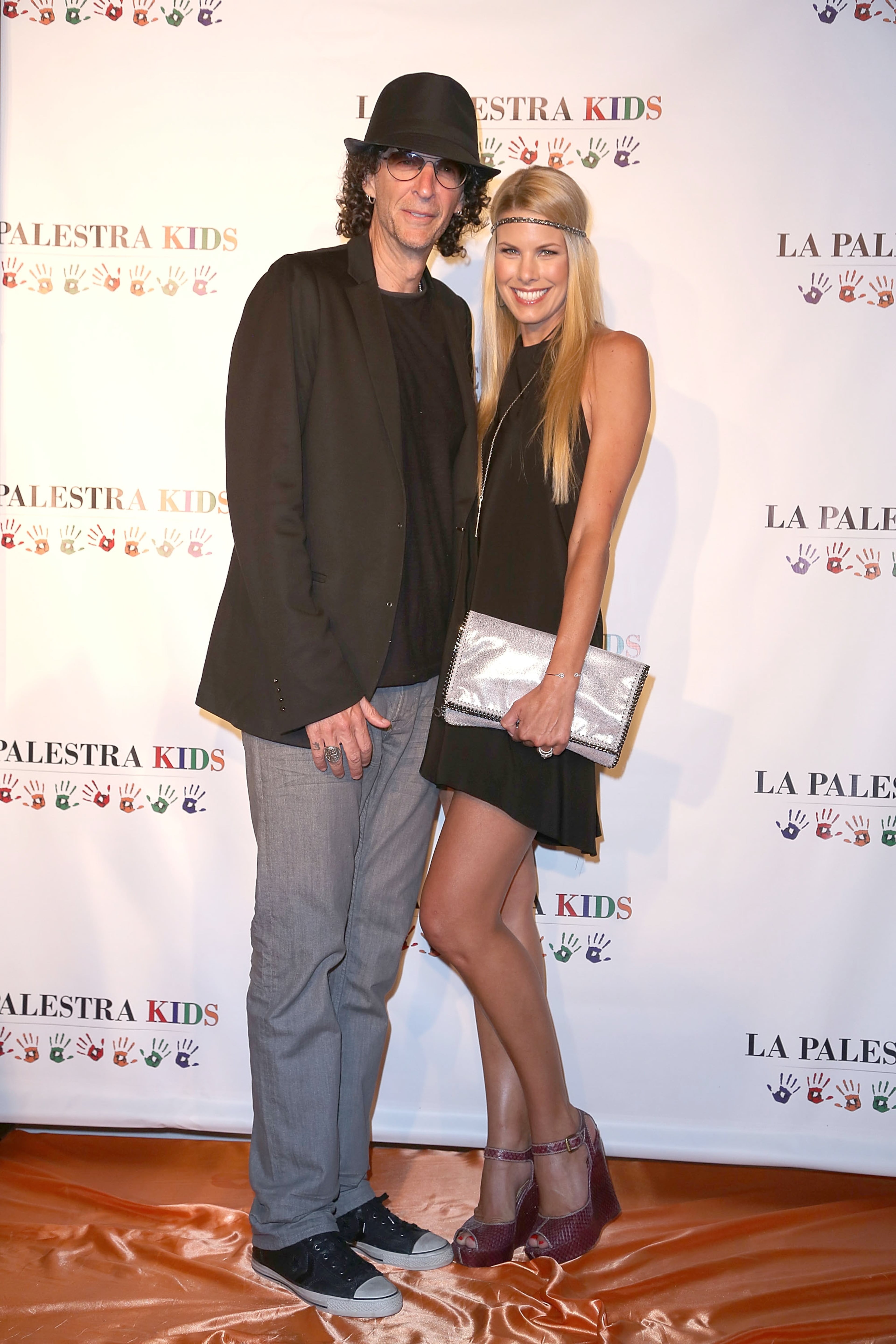 Beth Ostrosky Stern and Howard Stern attend La Palestra Kids Hamptons 2013 at East Hampton Studio on August 3, 2013 in Wainscott, New York. (Photo by Sonia Moskowitz/Getty Images)