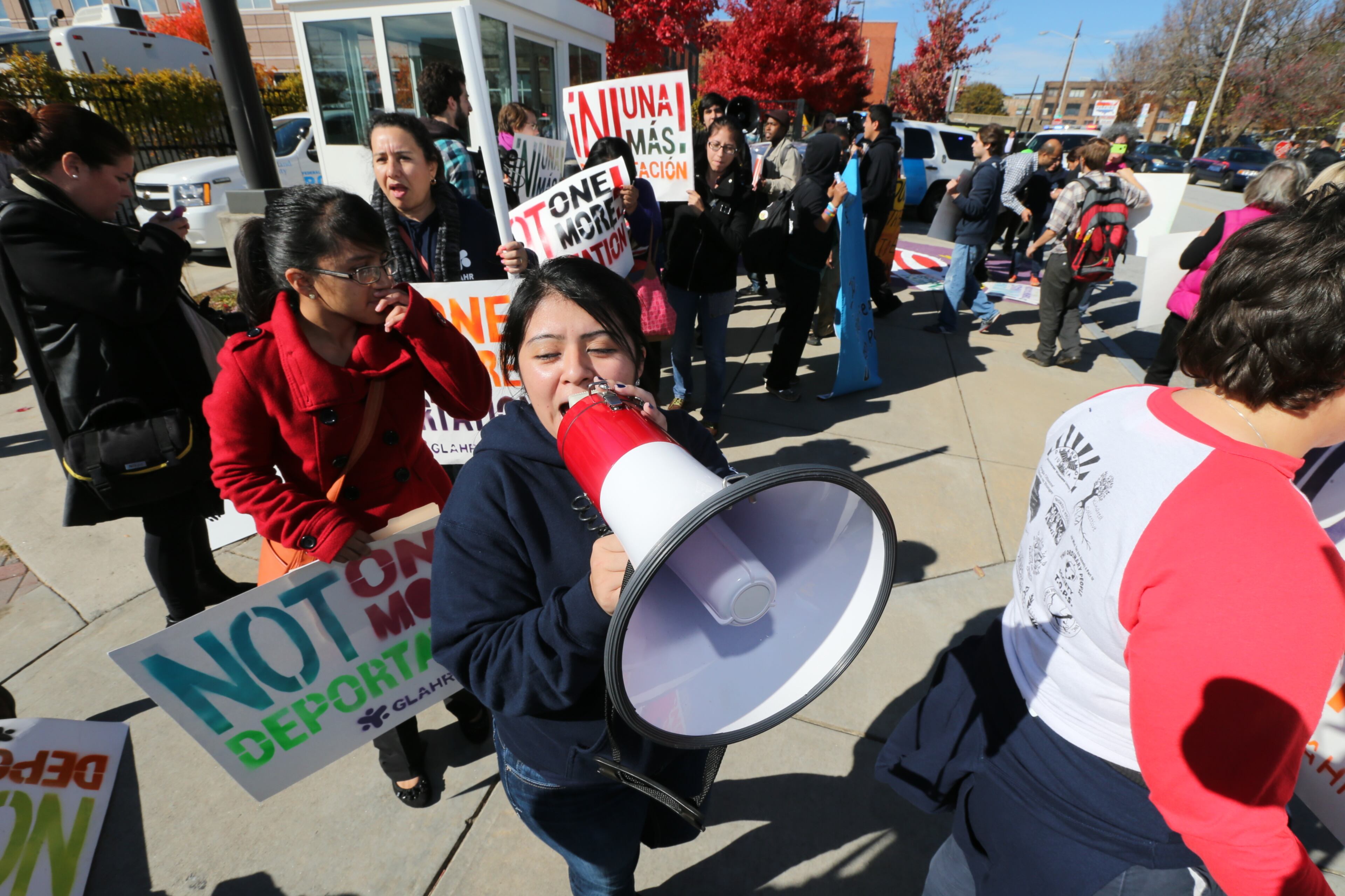Activists locked themselves to the gates outside a federal government building in downtown Atlanta Tuesday as part of a boisterous demonstration against the Obama administration's immigration enforcement policies. Witnesses said authorities used bolt cutters to break the bicycle locks the activists used and took 14 people into custody just outside a building that houses U.S. Immigration and Customs Enforcement offices and federal immigration courtrooms.