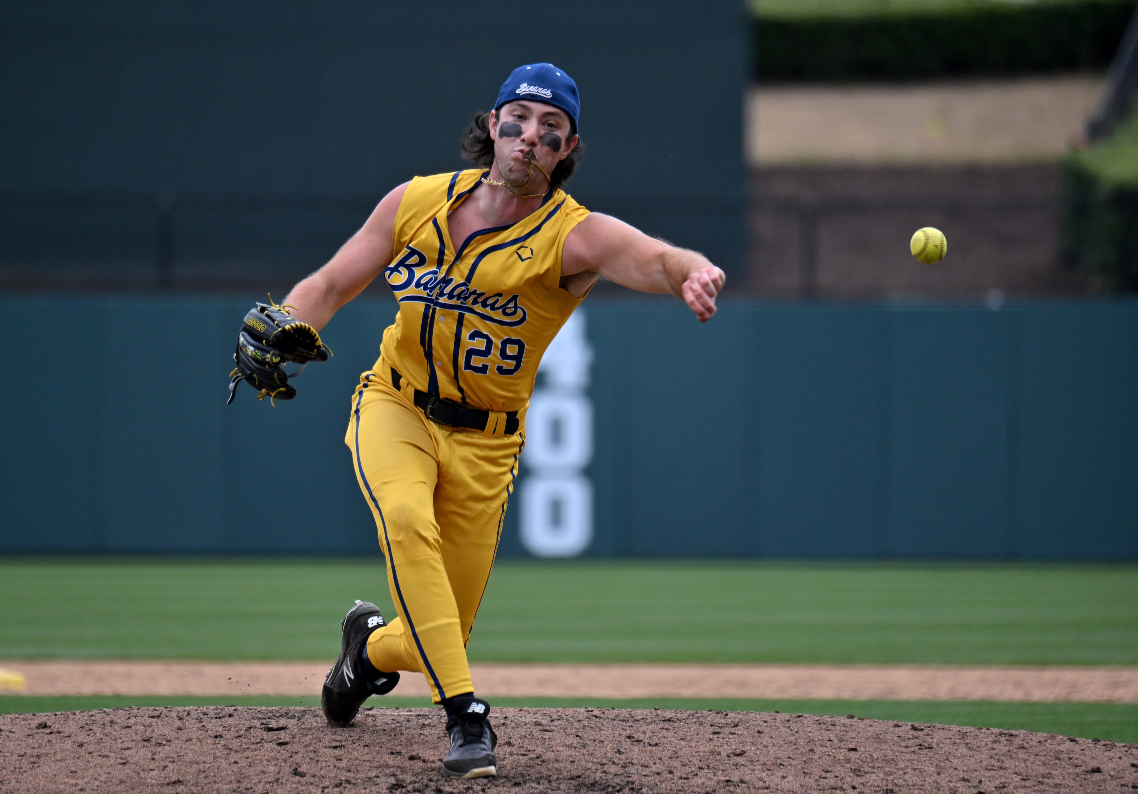 Savannah Bananas' Zack Phillips throws a pitch. (Hyosub Shin / Hyosub.Shin@ajc.com)
