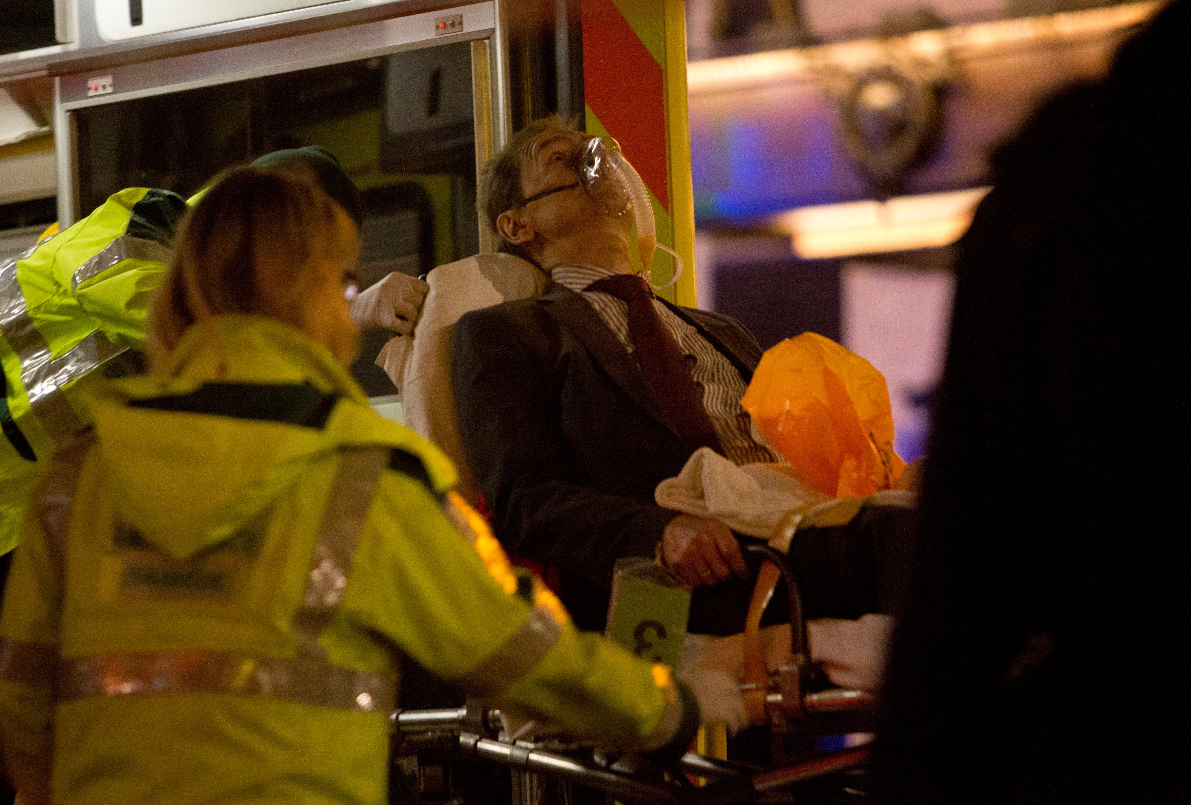 A man receives medical attention after part of the ceiling at the Apollo Theatre on Shaftesbury Avenue collapsed in central London December 19, 2013. Emergency services said nearly 90 people had been injured in a packed Londontheatre on Thursday when part of the ceiling collapsed during a performance, bringing the city's West End theatre district to a standstill.The audience was showered with masonry and debris following the incident at the Apollo Theatre, where about 720 people including many families were watching the hugely popular play "The Curious Incident of the Dog in the Night-Time."