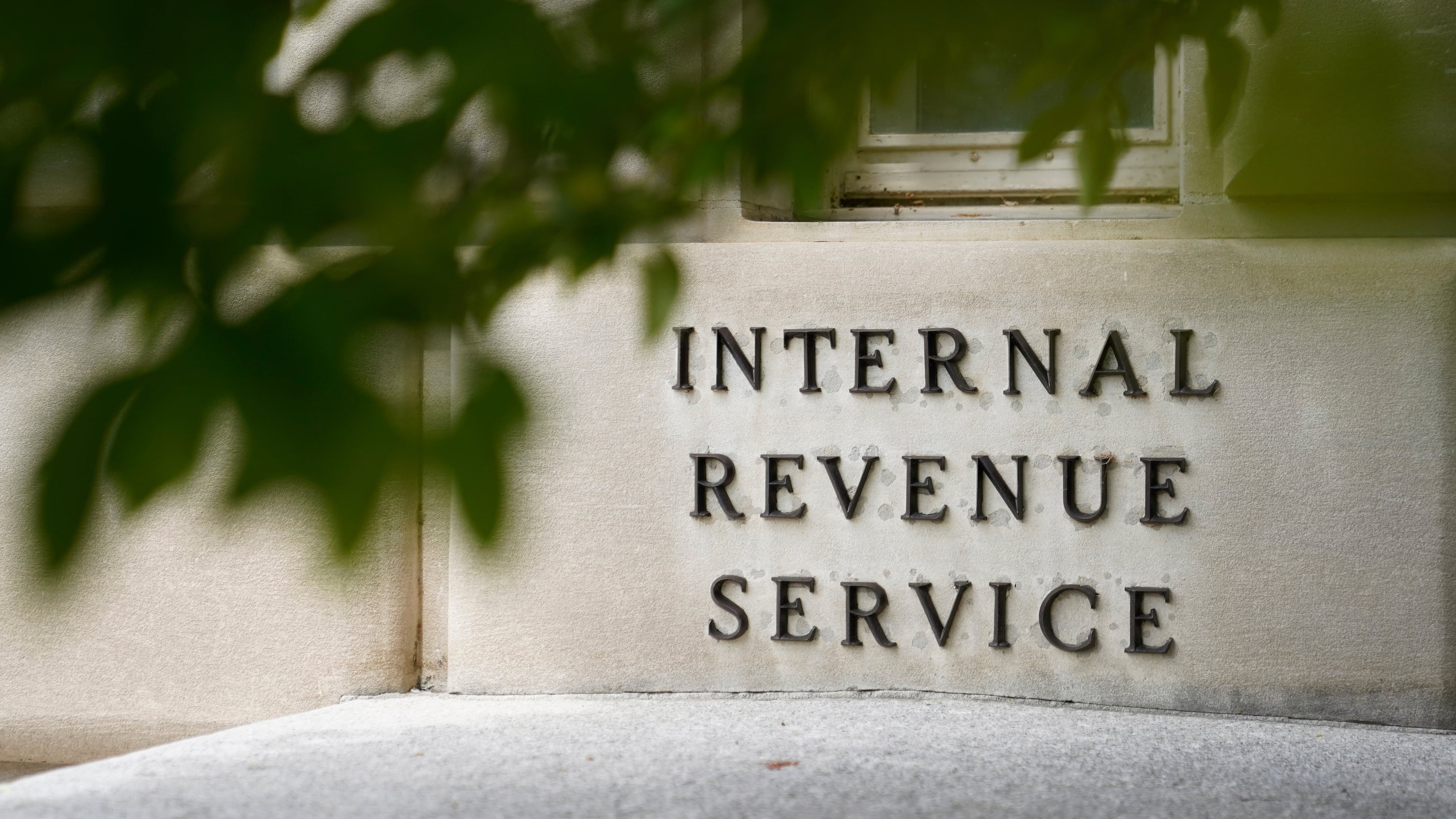 FILE - A sign is displayed outside the Internal Revenue Service building May 4, 2021, in Washington. (AP Photo/Patrick Semansky, File)