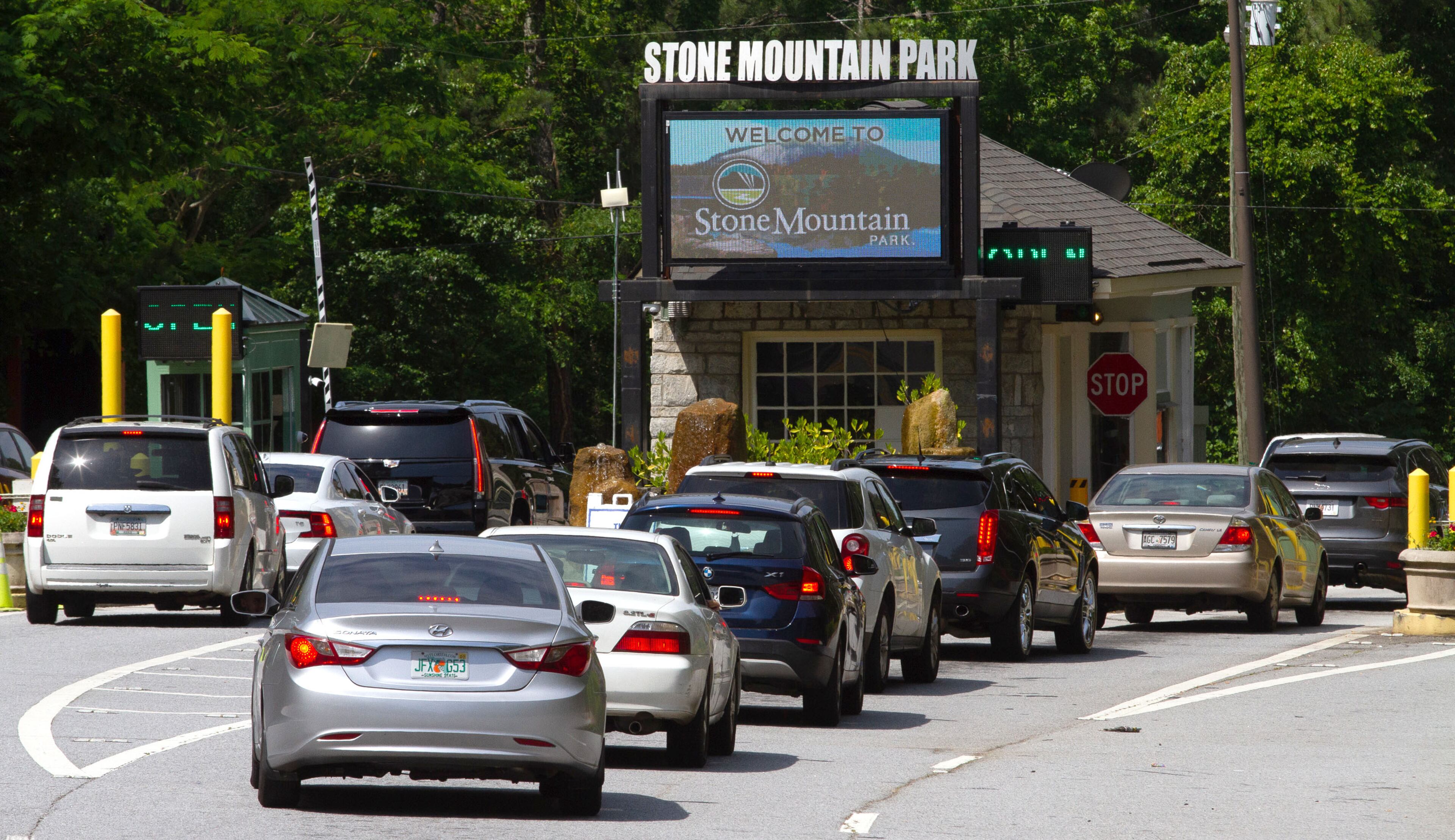Cars line up to get into Stone Mountain Park Sunday, May 17, 2020. STEVE SCHAEFER FOR THE ATLANTA JOURNAL-CONSTITUTION