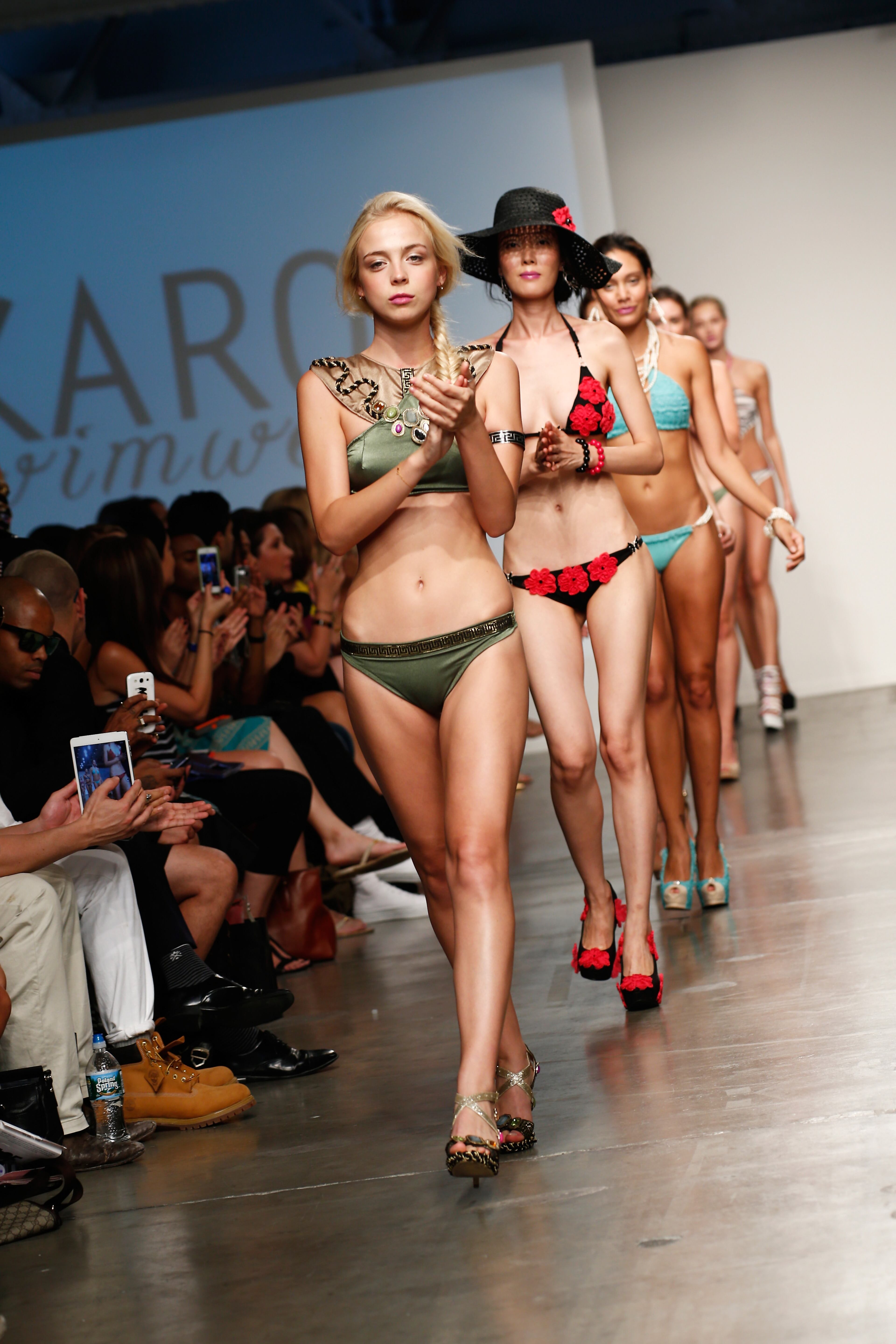 Models walk the runway at the Karo Swimwear show during Nolcha Fashion Week New York Spring/Summer 2014 presented by RUSK at Pier 59 Studios on Sept. 11, 2013, in New York City.