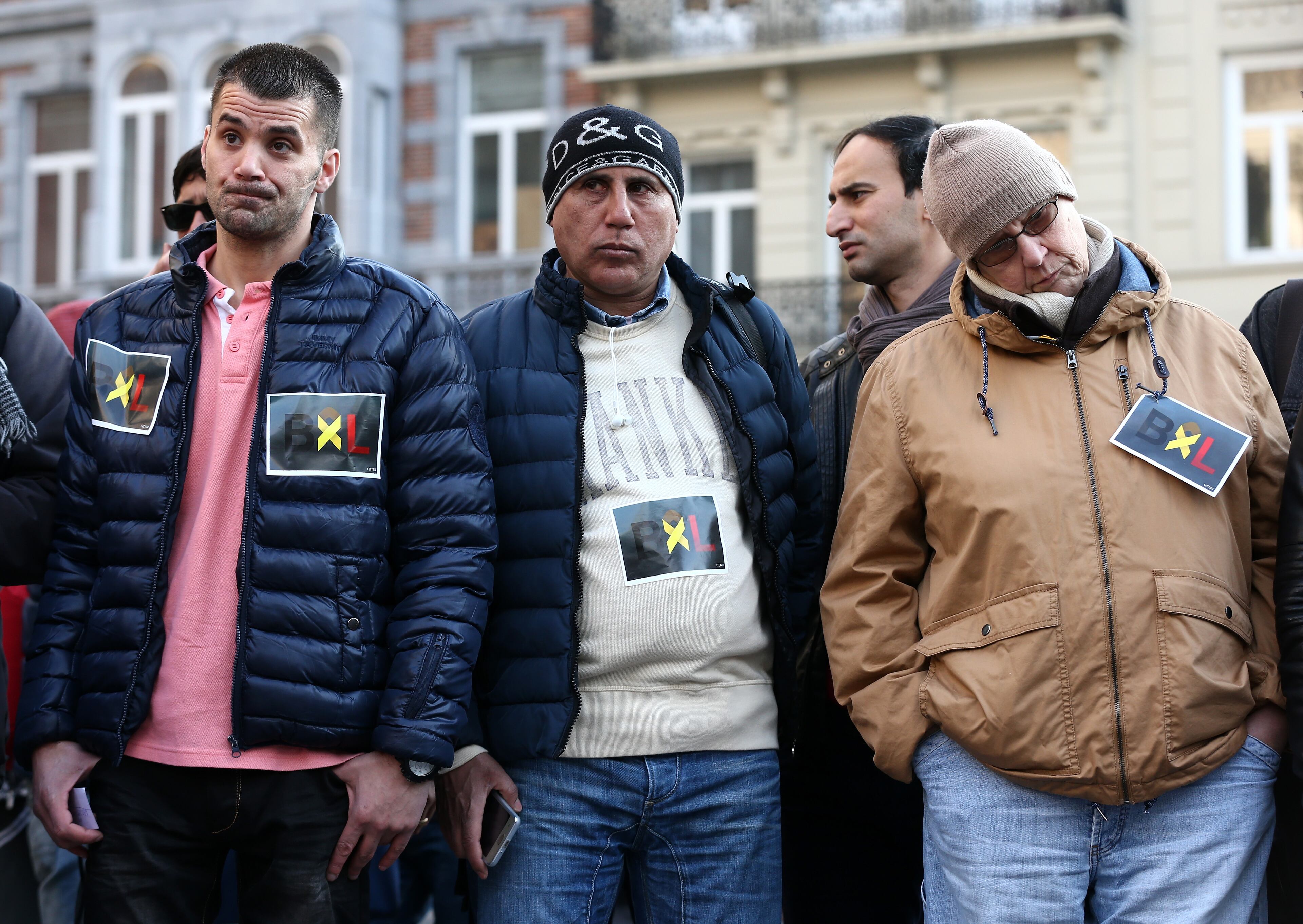 BRUSSELS, BELGIUM - MARCH 22: People gather at the Place de la Bourse following today's attacks on March 22, 2016 in Brussels, Belgium. At least 31 people are thought to have been killed after Brussels airport and a Metro station were targeted by explosions. The attacks come just days after a key suspect in the Paris attacks, Salah Abdeslam, was captured in Brussels. (Photo by Carl Court/Getty Images)