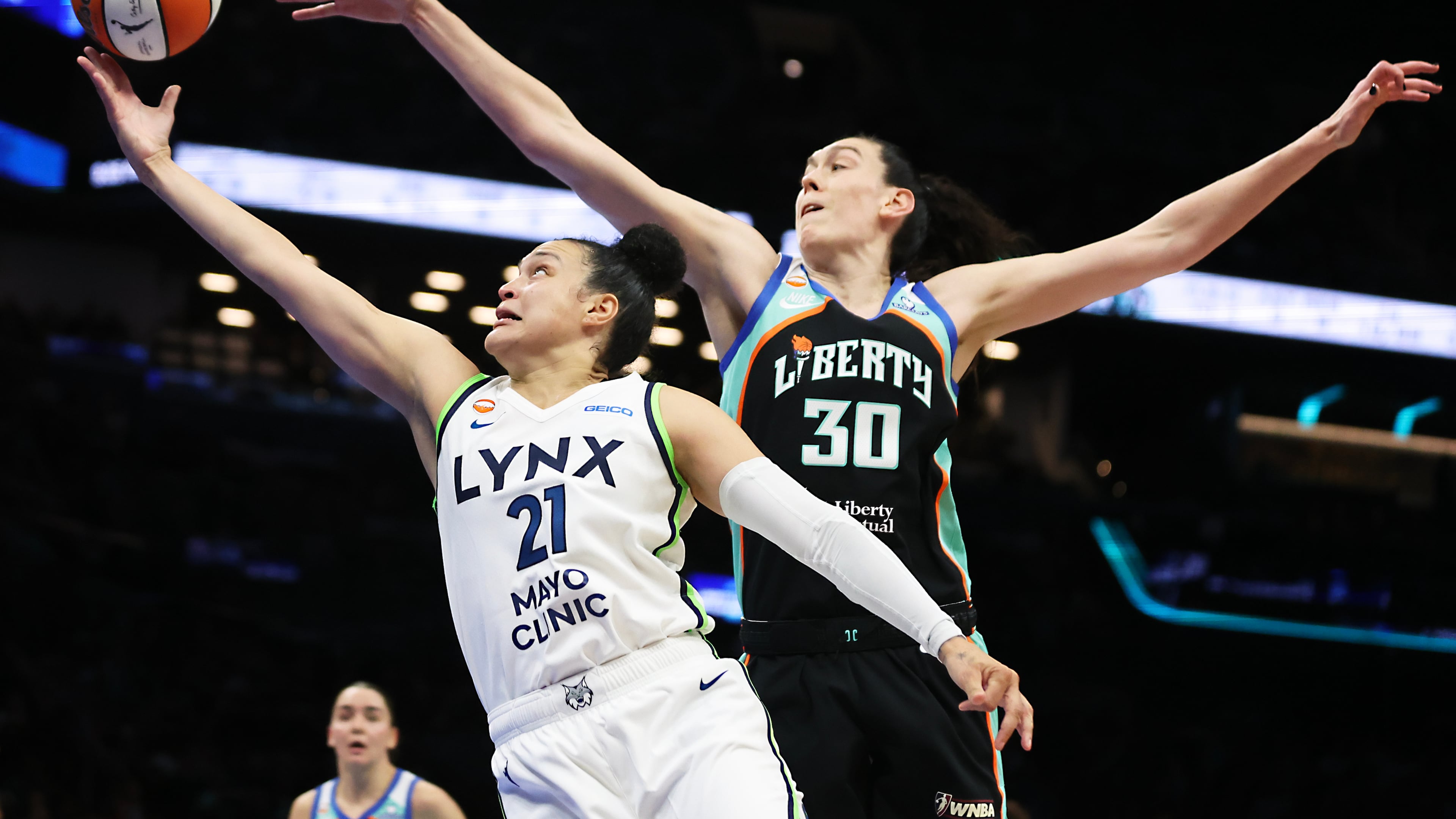 Minnesota Lynx guard Kayla McBride (21) drives to the basket past New York Liberty forward Breanna Stewart (30) during the first half of Game 2 of a WNBA basketball first-round playoff series, Tuesday, Sept. 29, 2026, in New York. (AP Photo/Heather Khalifa)