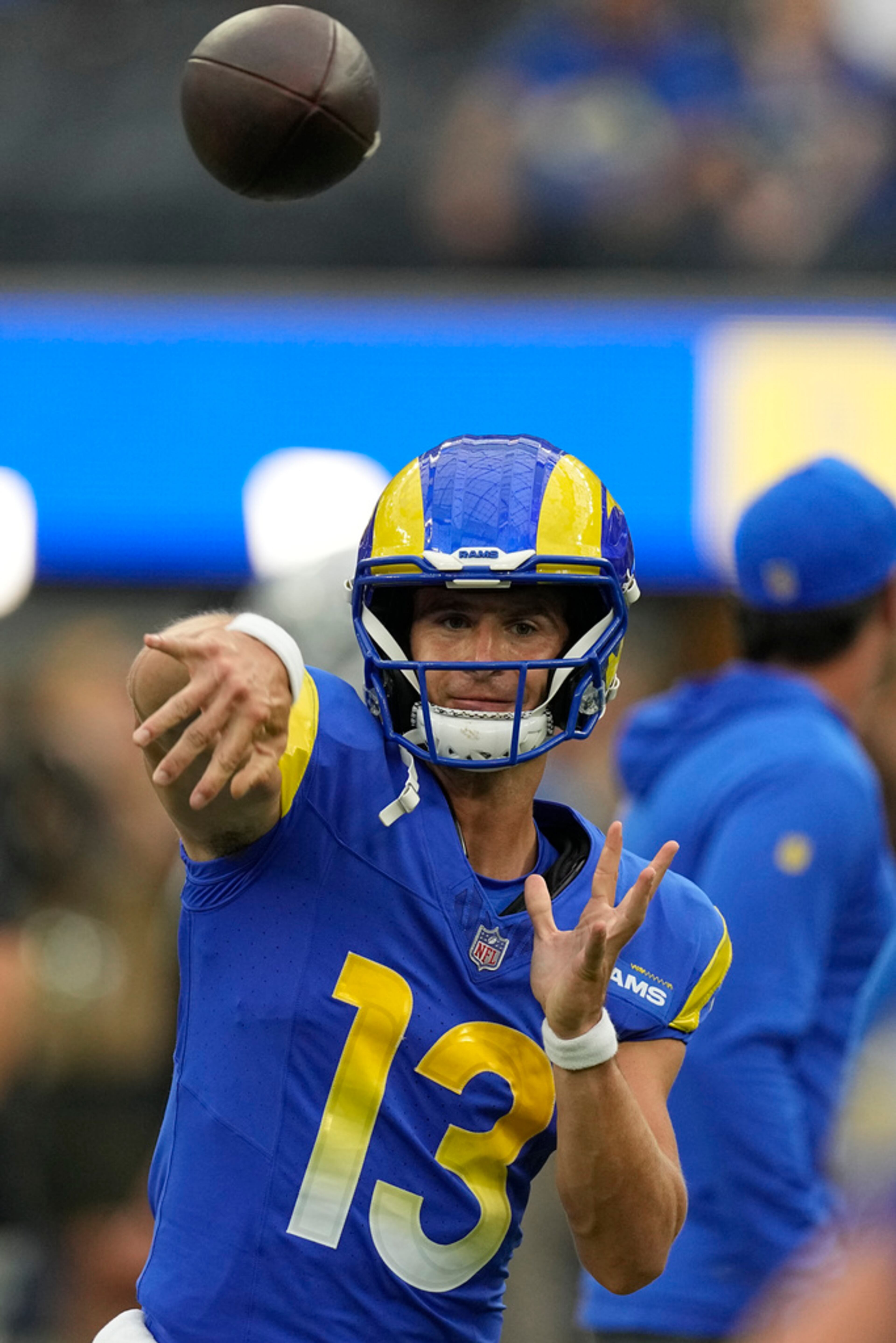 Los Angeles Rams quarterback Stetson Bennett warms up before a preseason NFL football game against the Las Vegas Raiders Saturday, Aug. 19, 2023, in Inglewood, Calif. (AP Photo/Mark J. Terrill)