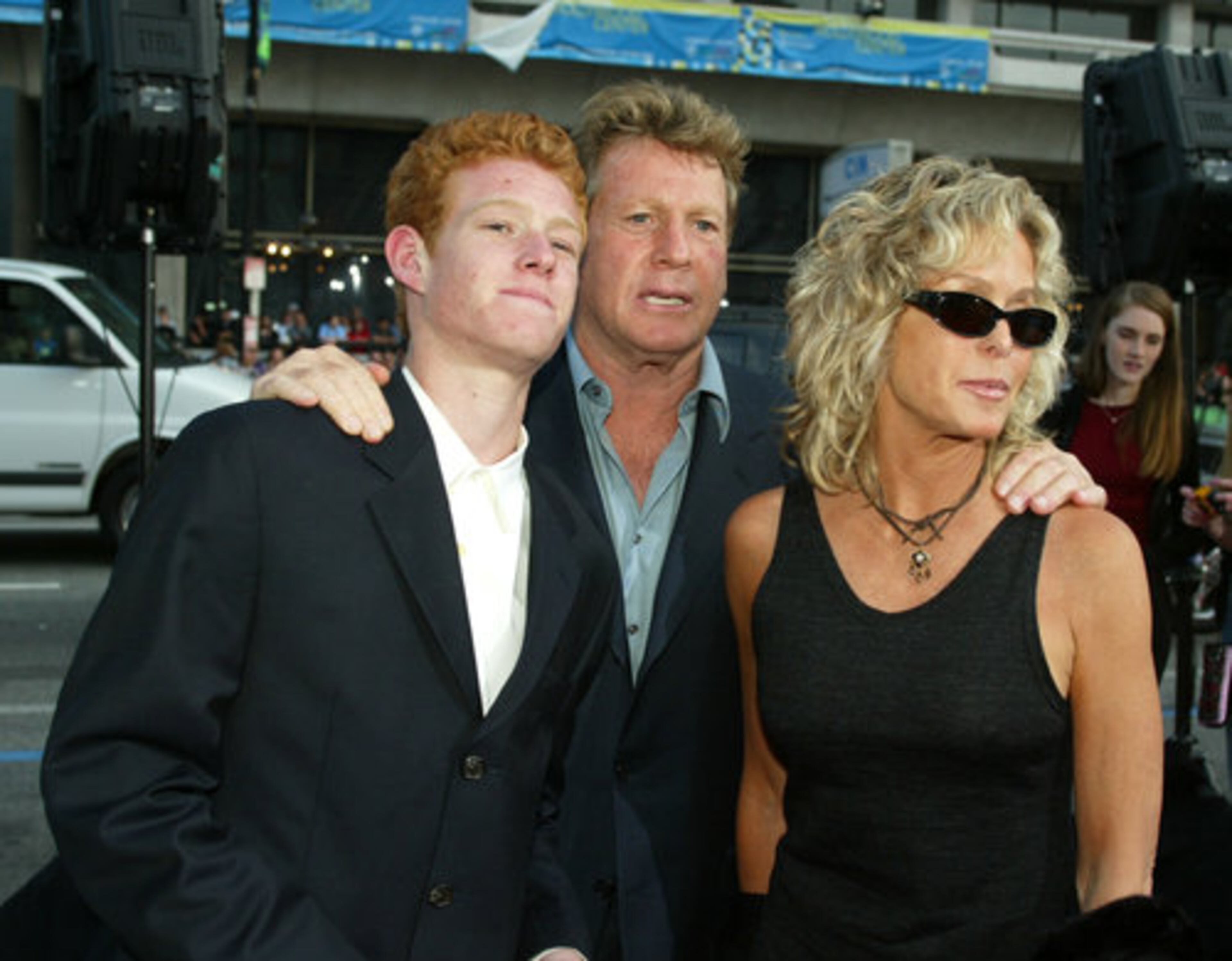 Their son, Redmond (left), has reportedly struggled with drugs and was arrested in April on suspicion of bringing narcotics into a jail facility.