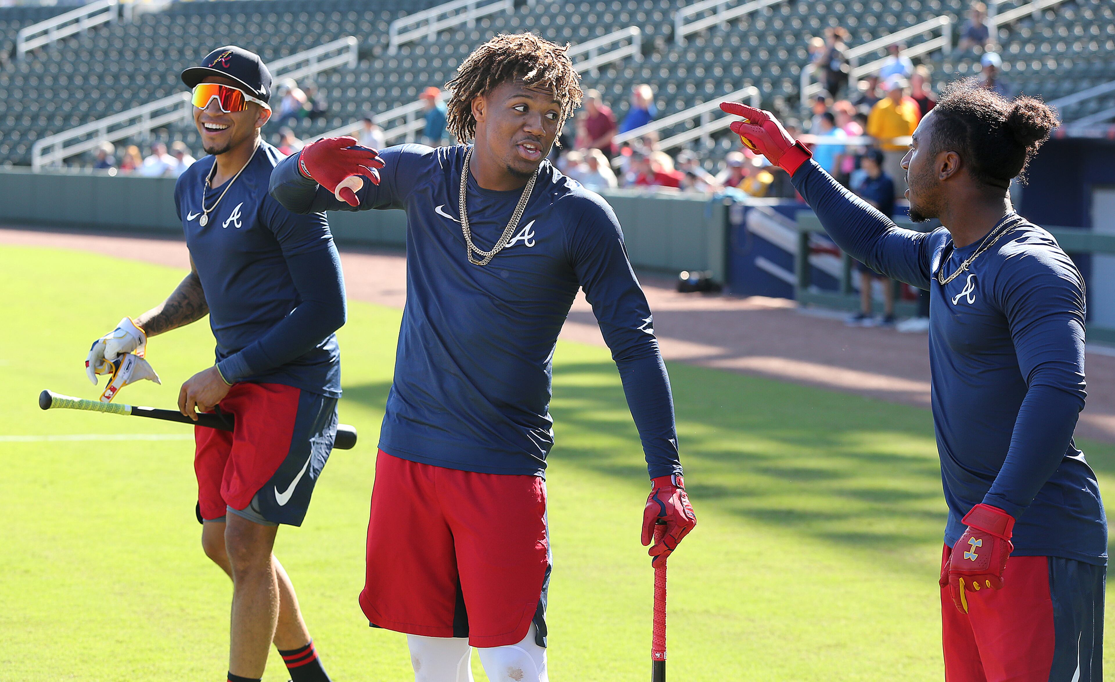 Braves (from left) Johan Camargo, Ronald Acuna Jr., and Ozzie Albies share a laugh arguing over who had the most home runs during batting practice in CoolToday Park at spring training on Saturday, Feb. 15, 2020, in North Port. Curtis Compton ccompton@ajc.com