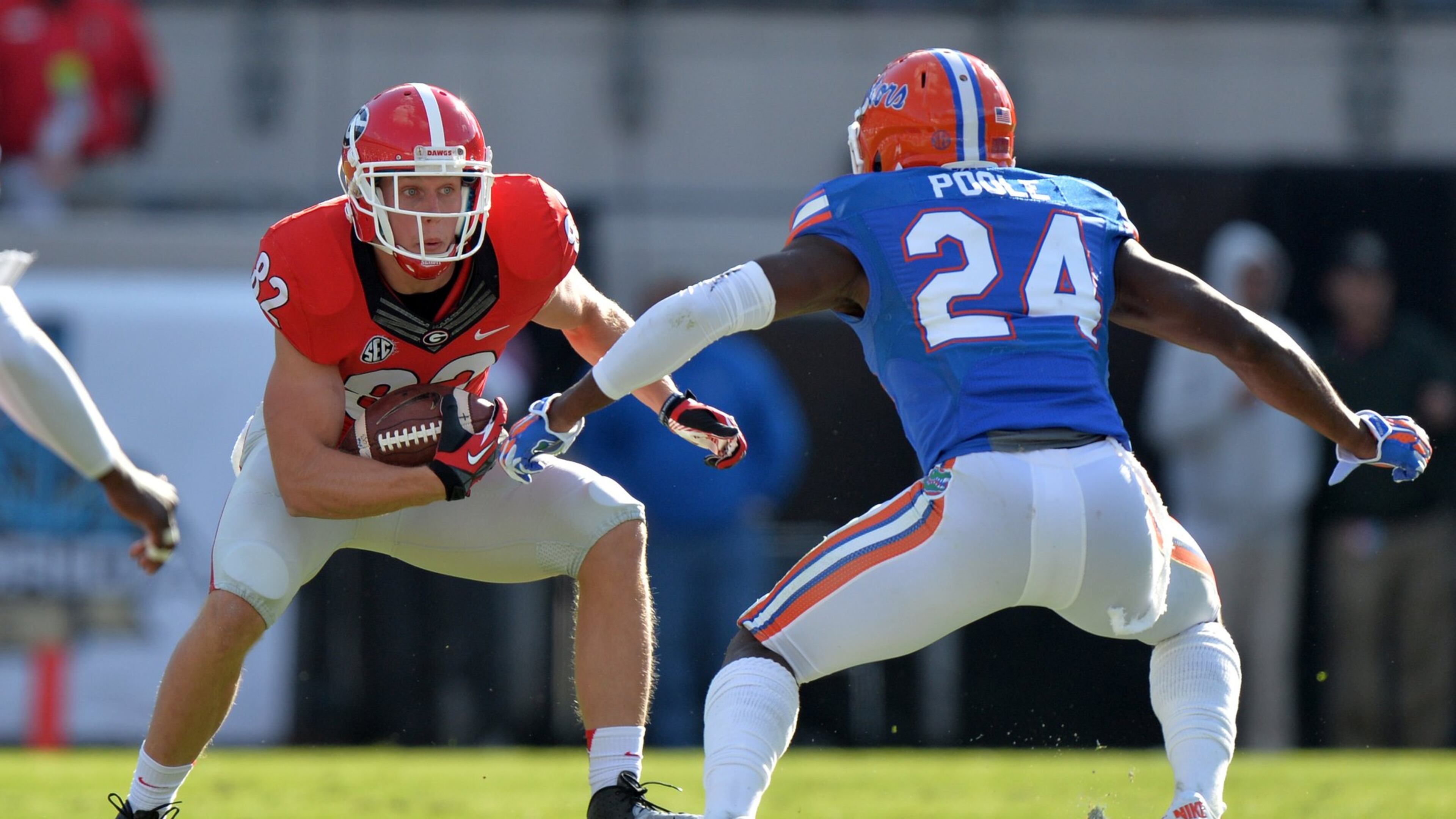 Georgia wide receiver Michael Bennett, shown trying to elude Florida defensive back Brian Poole last week, said the SEC East race remains fluid because both leader Missouri and second-place Georgia have tough games remaining. BRANT SANDERLIN / BSANDERLIN@AJC.COM