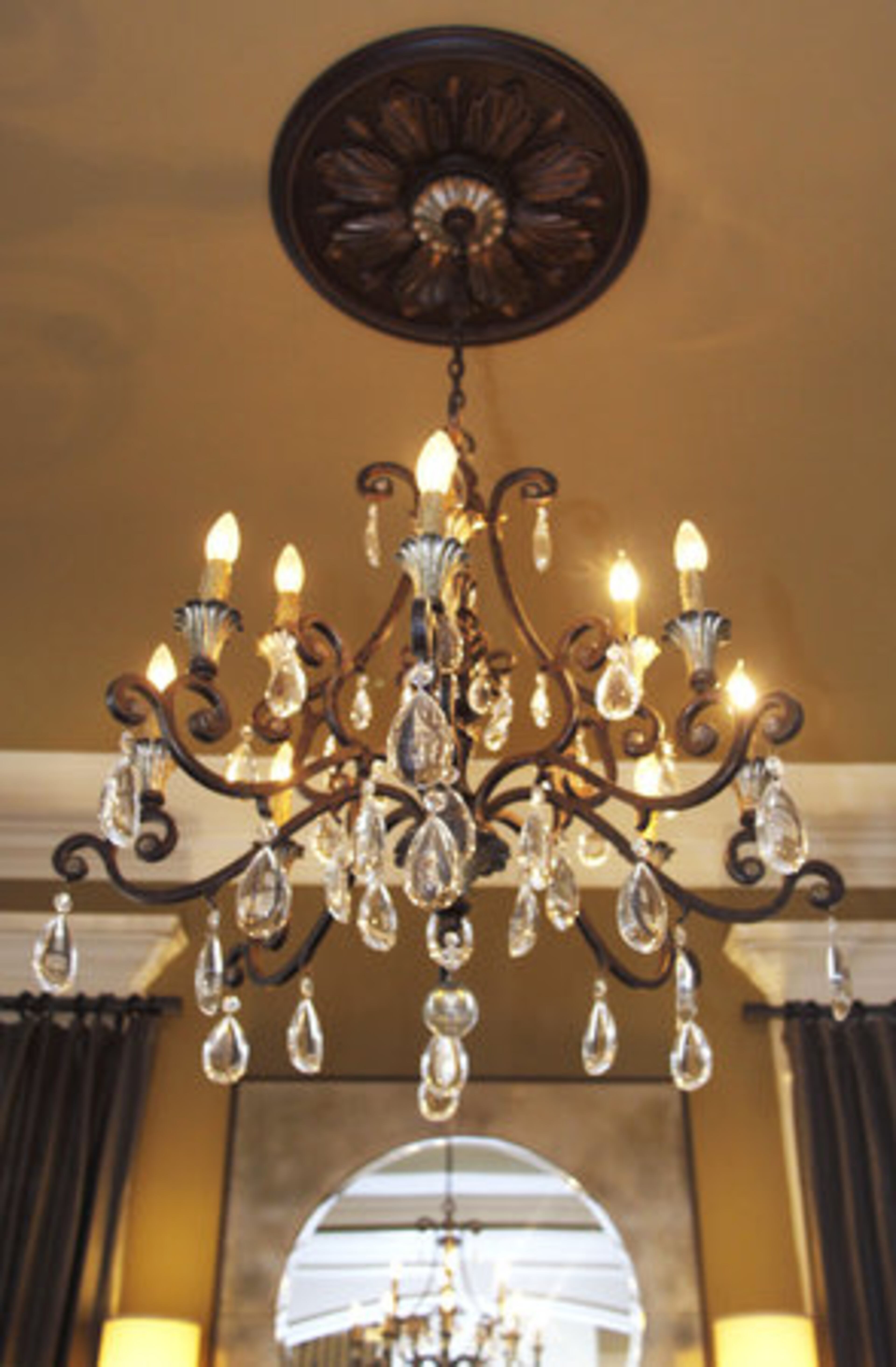 The chandelier in the formal dining room in the home of Kesha Kline conveys her approach to mixing old with new.