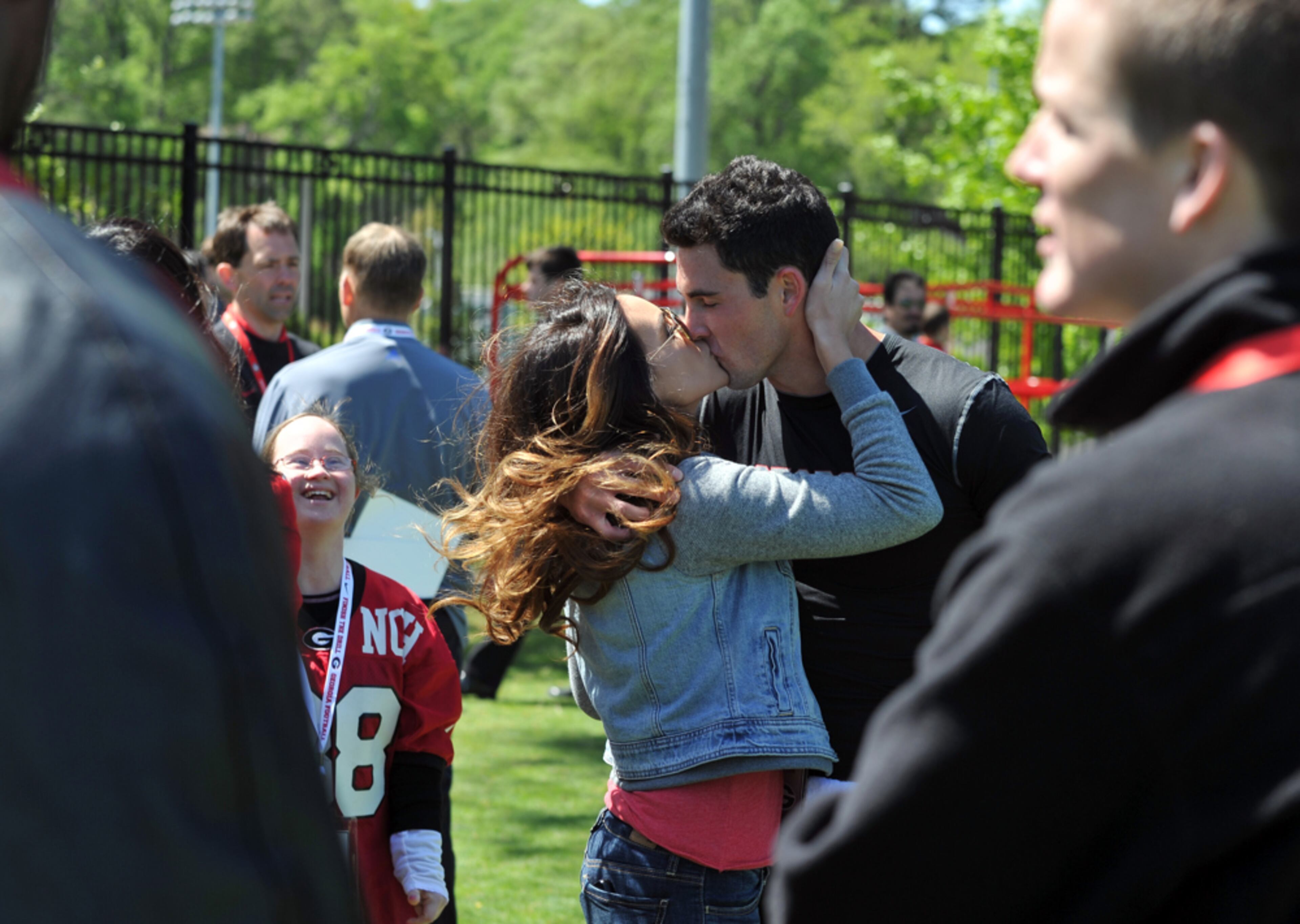 A KISS FOR LUCK--April 16, 2014. Former Georgia quarterback Aaron Murray gets a kiss from his girlfriend Kacie McDonnell after completing his workout in front of NFL scouts during UGA's Pro Day Wednesday April 16, 2014 in Athens. Murray's collegiate career ended with a left knee injury against Kentucky, but has since recovered. BRANT SANDERLIN /BSANDERLIN@AJC.COM