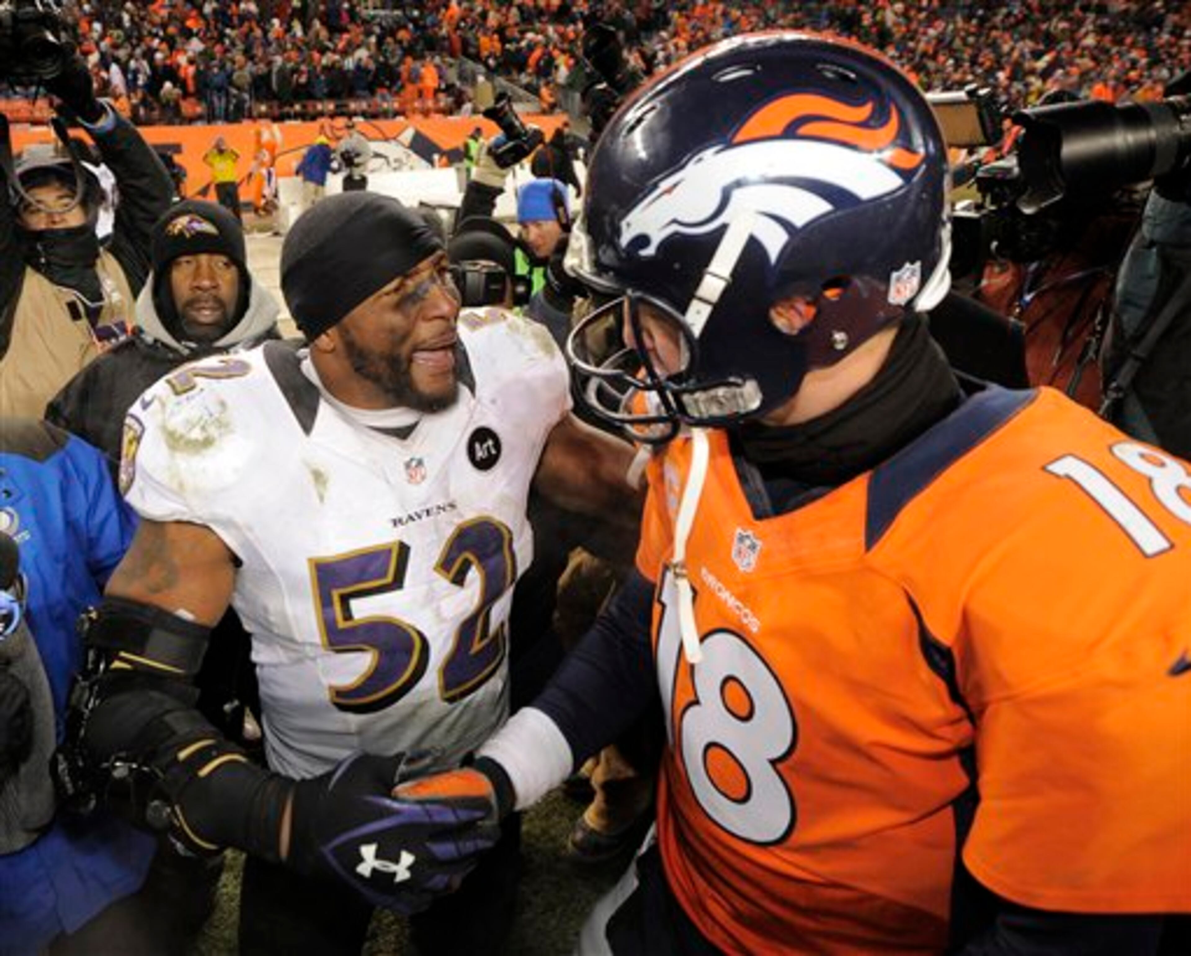 Baltimore Ravens inside linebacker Ray Lewis shakes hands Denver Broncos quarterback Peyton Manning (18) after the Ravens won 38-35 in overtime of an AFC divisional playoff NFL football game, Saturday, Jan. 12, 2013, in Denver. (AP Photo/Jack Dempsey)