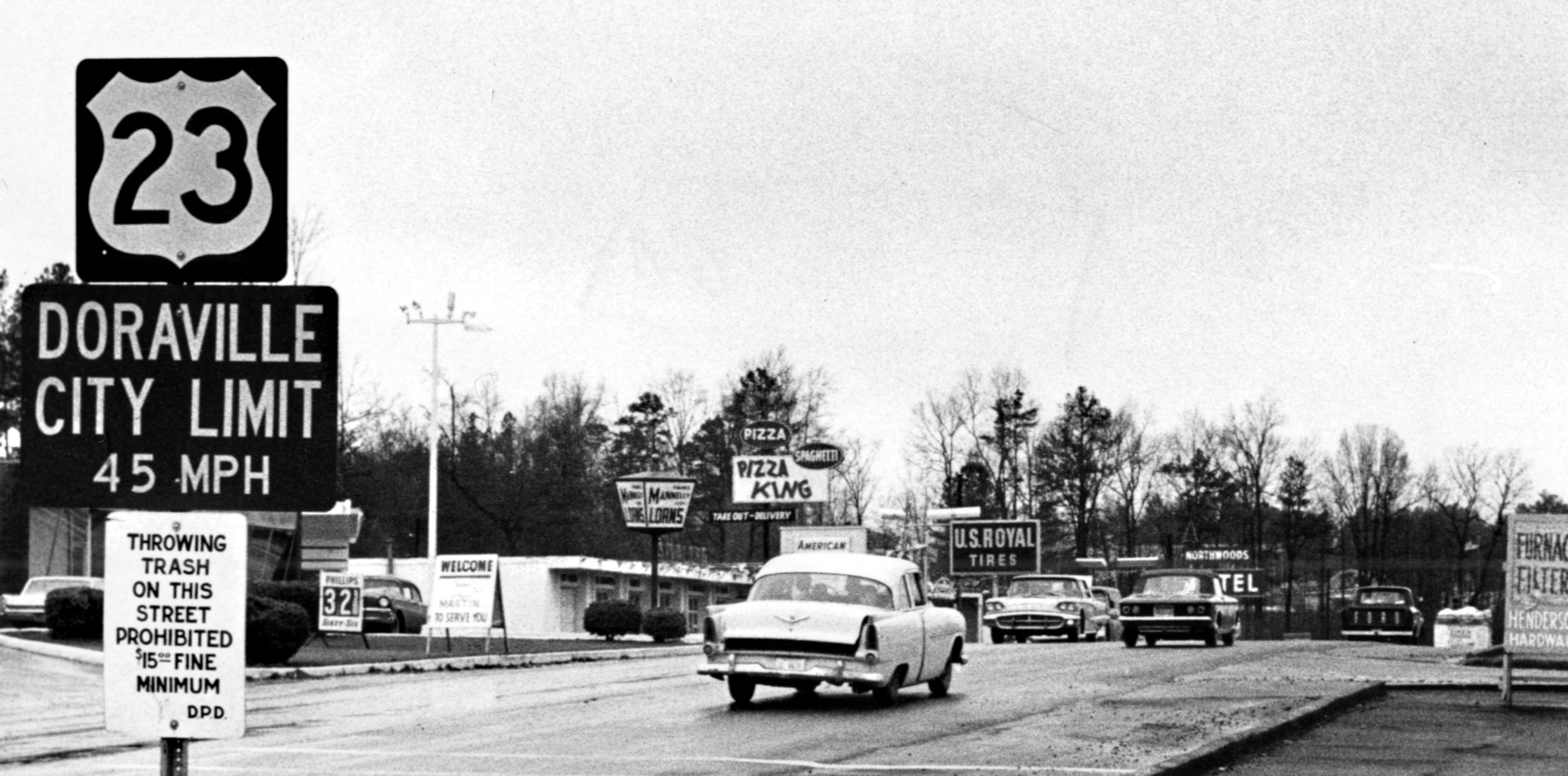 An array of signs greet visitors on Buford Highway at the entrance to Doraville in 1966.