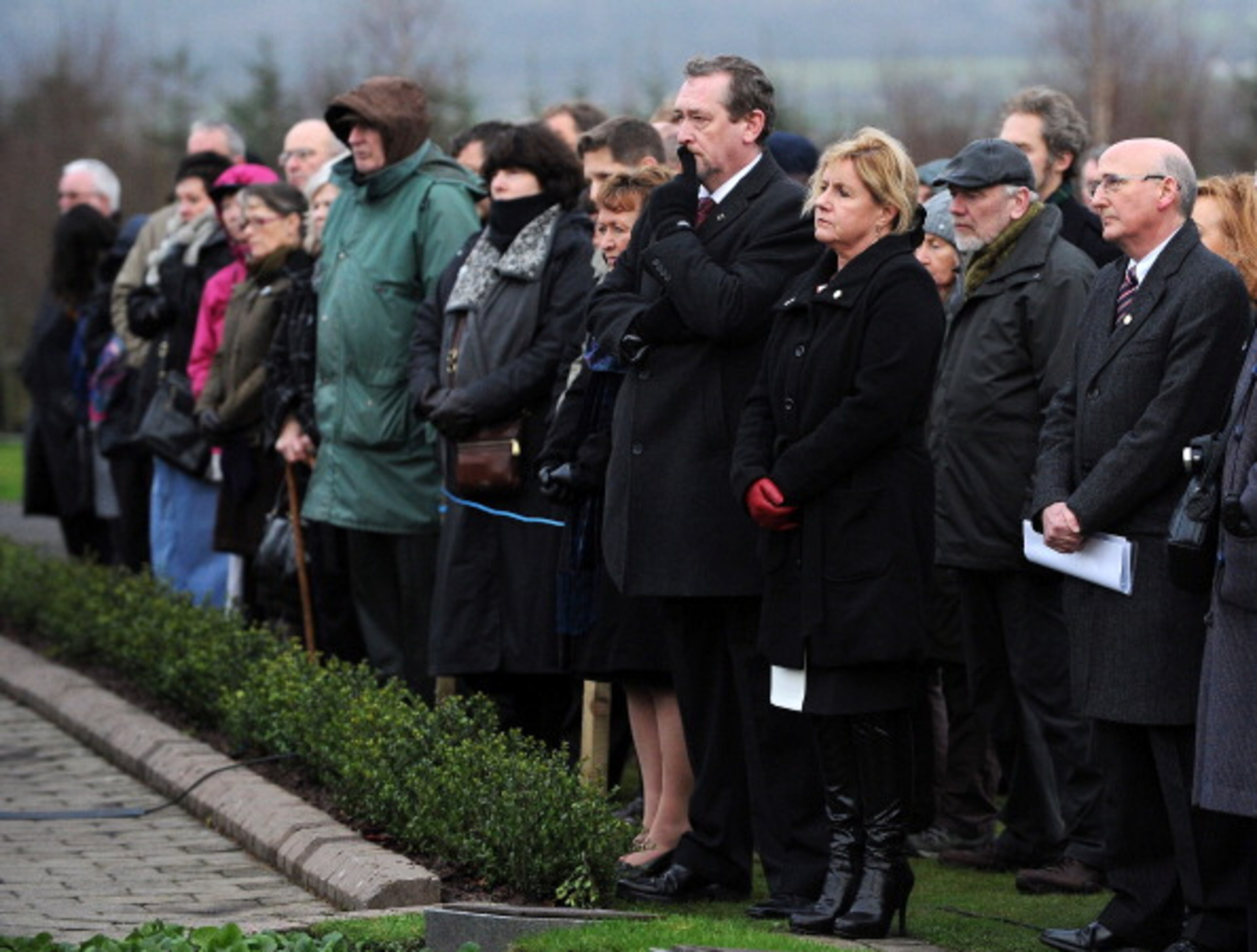 LOCKERBIE, SCOTLAND - DECEMBER 21: Families and relatives attend a memorial service in Dryfesdale cemetery to commemorate the 25th anniversary of the air disaster on December 21, 2013 in Lockerbie, Scotland. Pan Am Flight 103 exploded over Lockerbie on December 21st, 1988, killing all those on board and a further eleven on the ground. (Photo by Ian Forsyth/Getty Images)