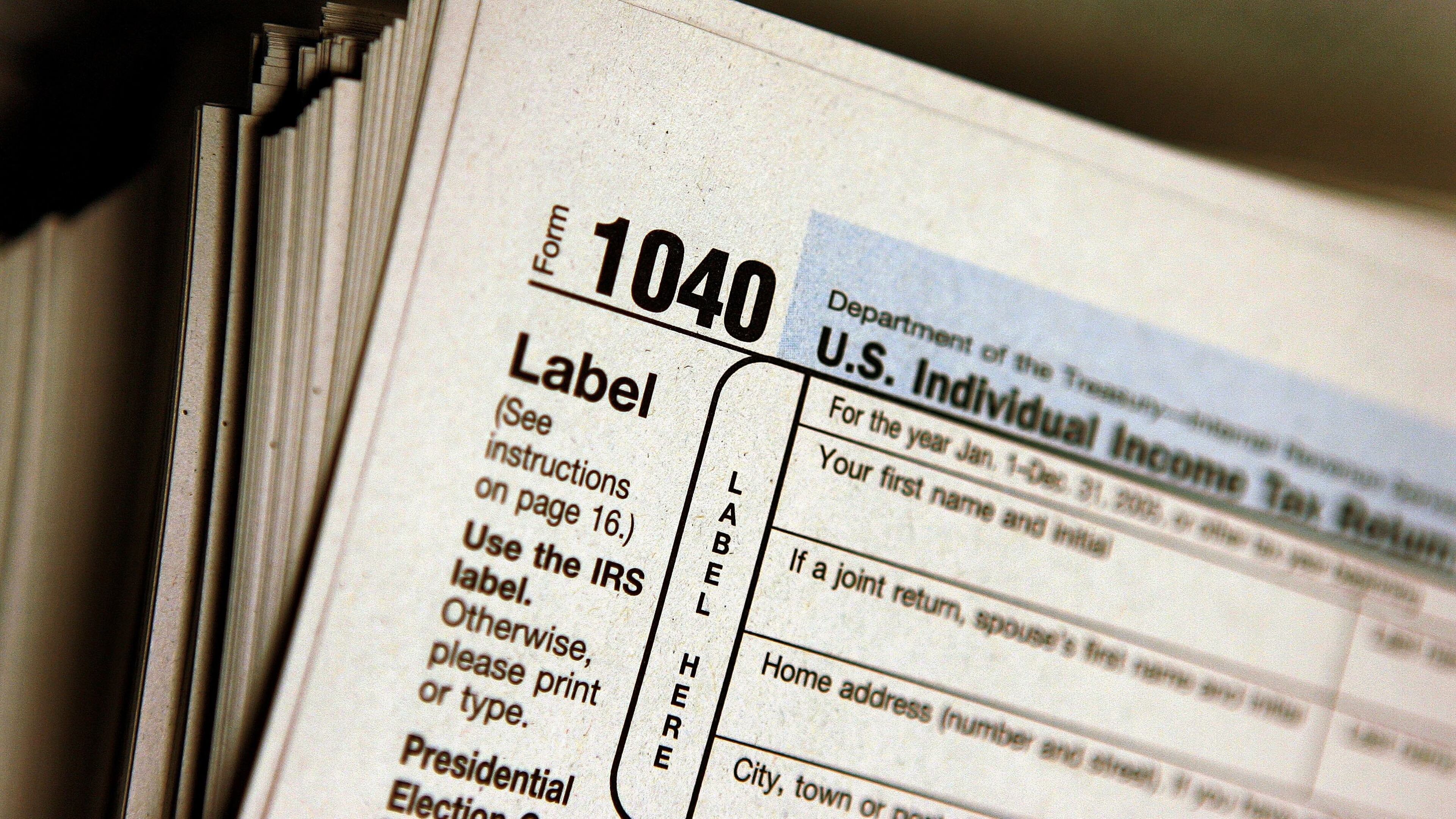 DES PLAINES, IL - MARCH 23: The top of a form 1040 individual income tax return for 2005 is seen atop a stack on the same at the Des Plaines Public Library March 23, 2006 in Des Plaines, Illinois. Americans are preparing for the income tax filing deadline next month whether using tax software, filing on the paper forms or using a tax preparer. (Photo by Tim Boyle/Getty Images)