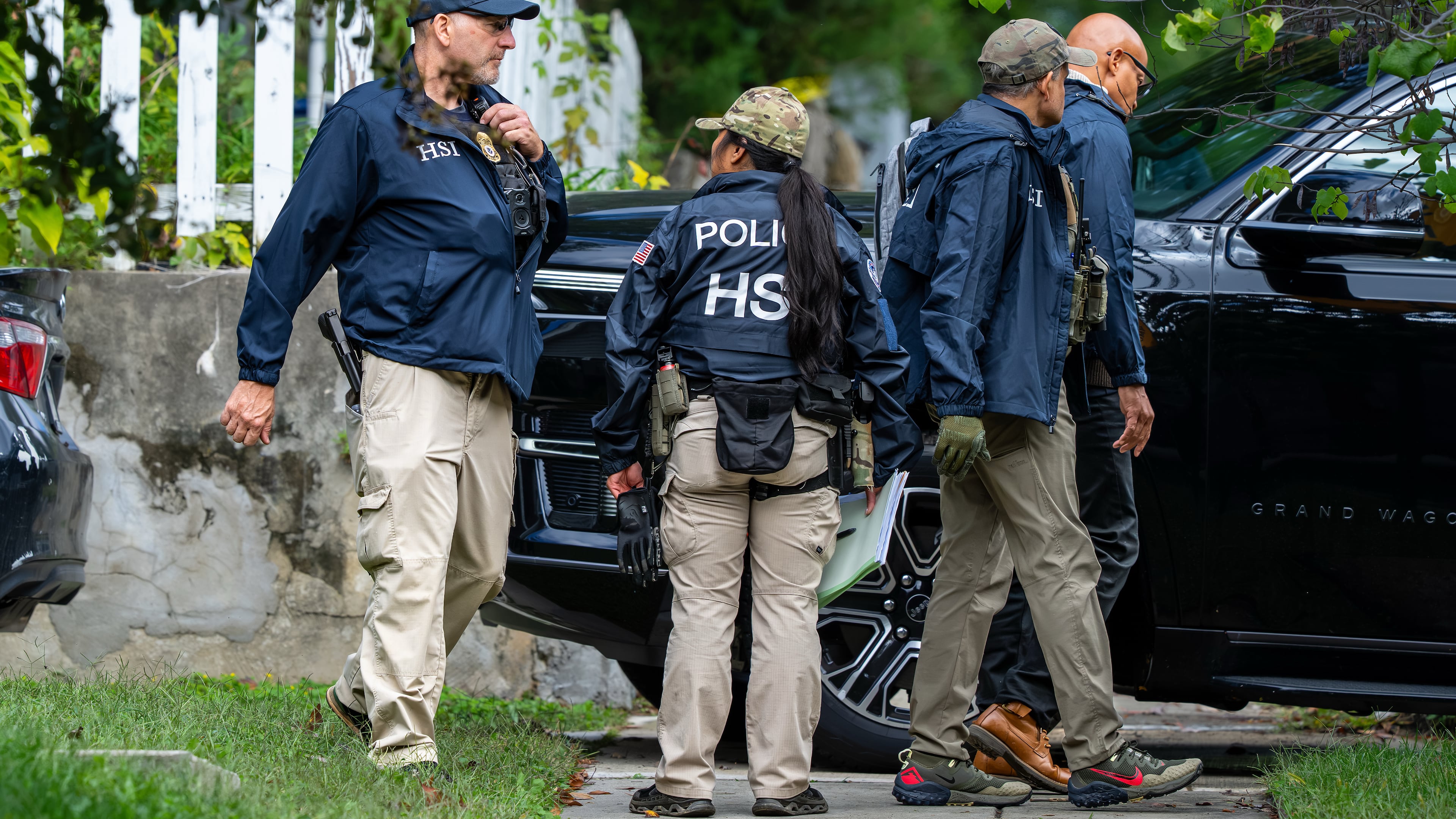 Homeland Security officers leave the Washington residence of Rep. Ilhan Omar, D-Minn., after a search, Monday, Oct. 12, 2026. (AP Photo/J. Scott Applewhite)