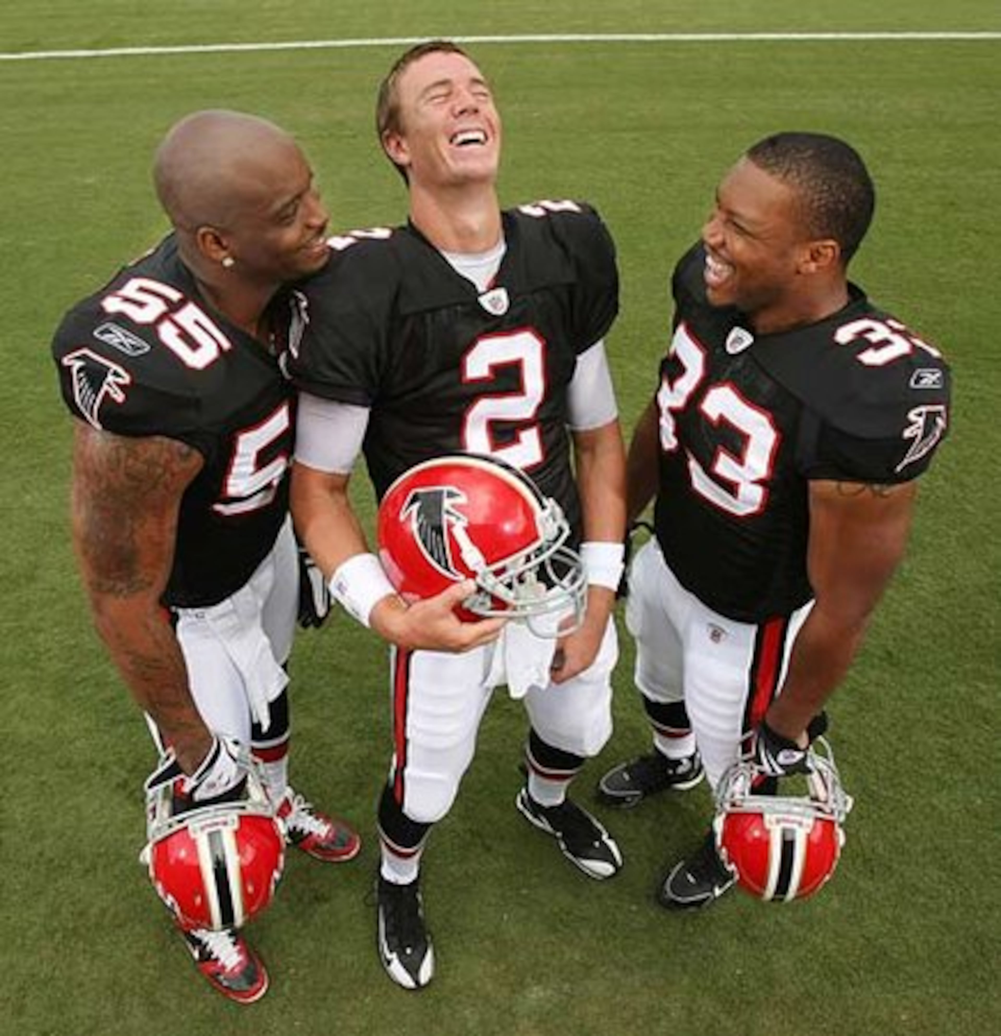 WHO IS THIS 'MATTY ICE'? Quarterback Matt Ryan (center) shows he's good for a laugh as John Abraham (left) and Michael Turner have a little fun during the throwback video shoot.