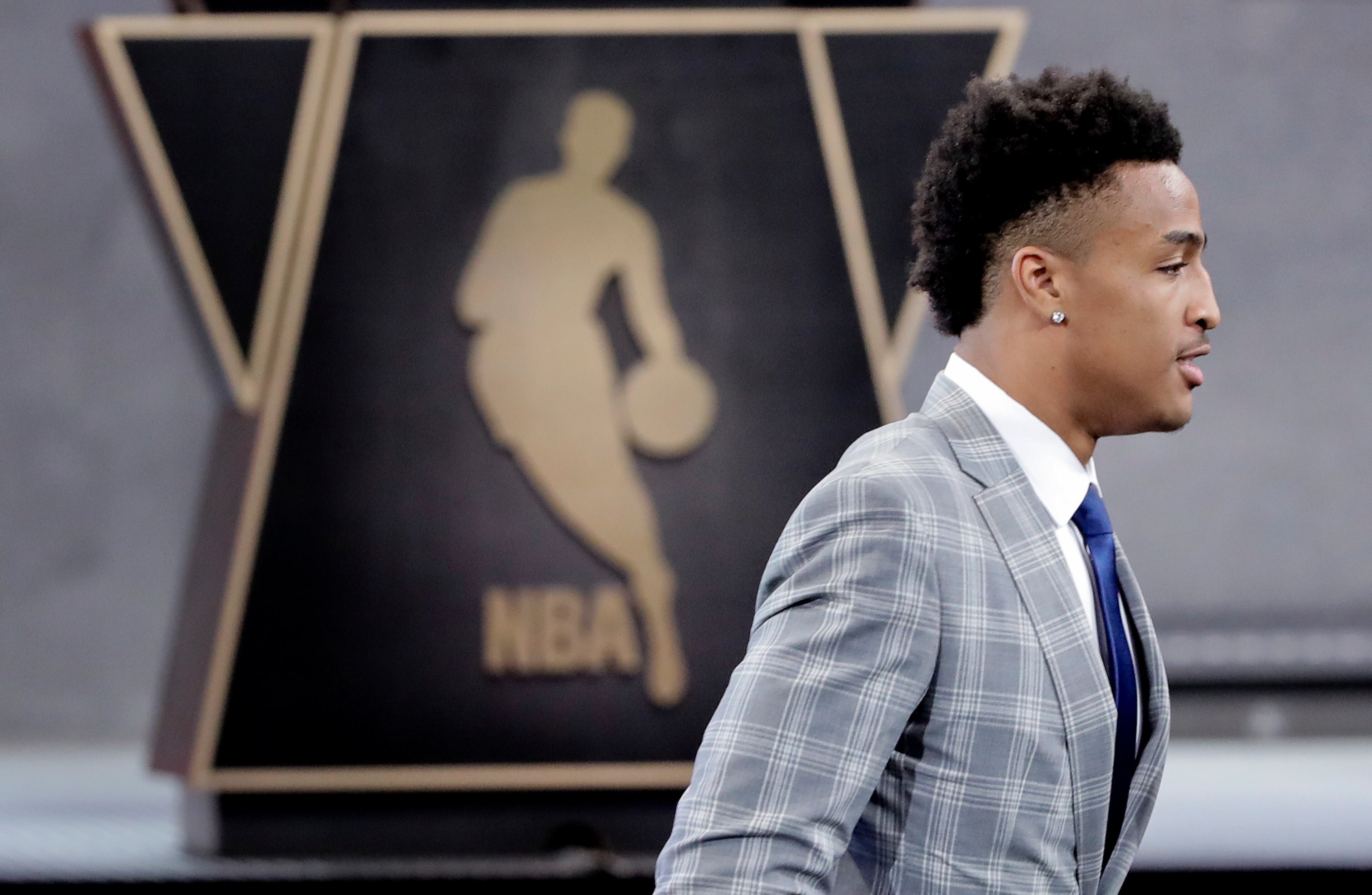 Wake Forest's John Collins walks up to the stage after being selected by the Atlanta Hawks as the 19th pick overall during the NBA basketball draft, Thursday, June 22, 2017, in New York. (AP Photo/Frank Franklin II)