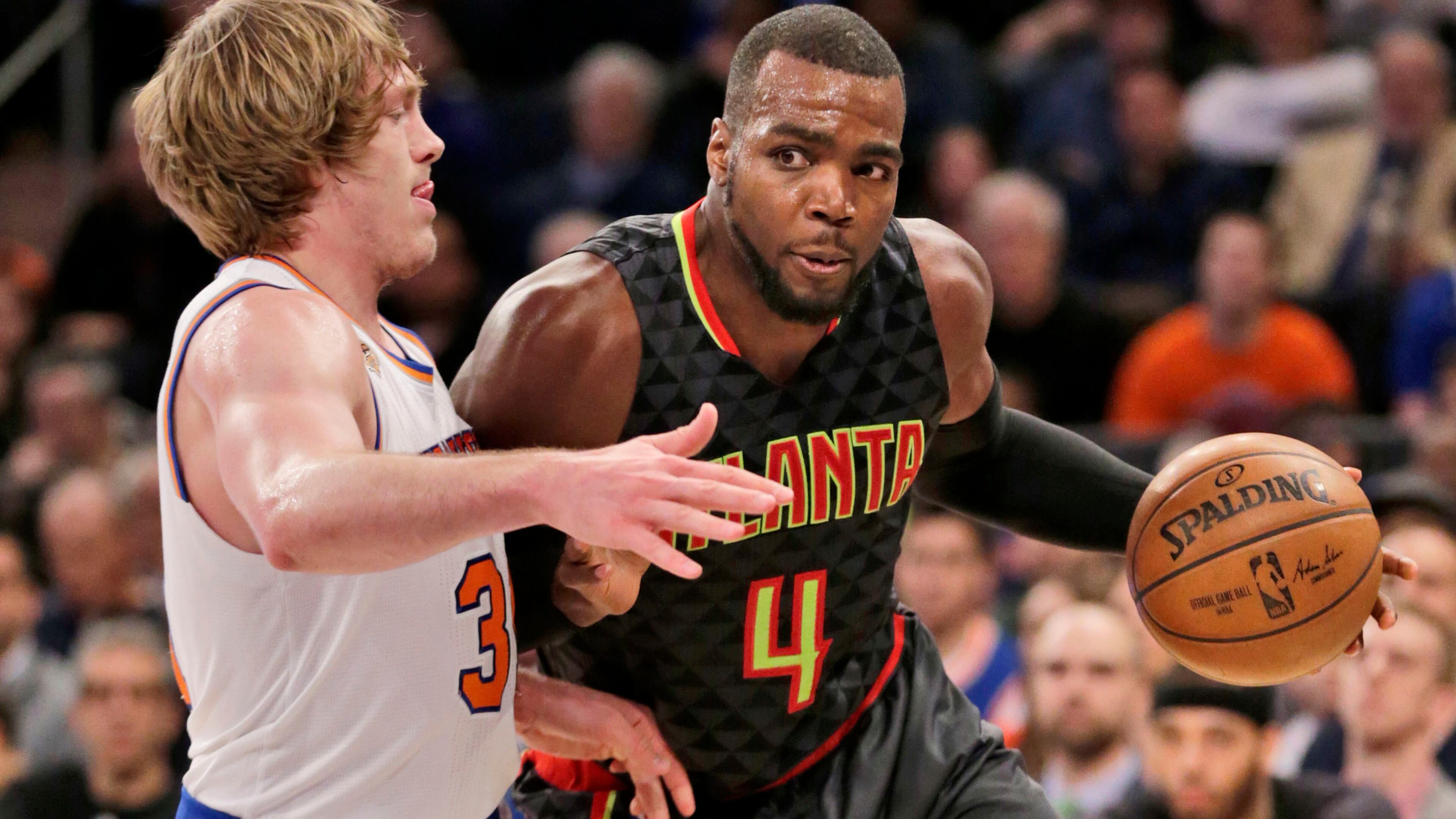Atlanta Hawks’ Paul Millsap, right, pushes past New York Knicks’ Ron Baker during the second half of the NBA basketball game, Monday, Jan. 16, 2017 in New York. The Hawks defeated the Knicks 108-107. (AP Photo/Seth Wenig)