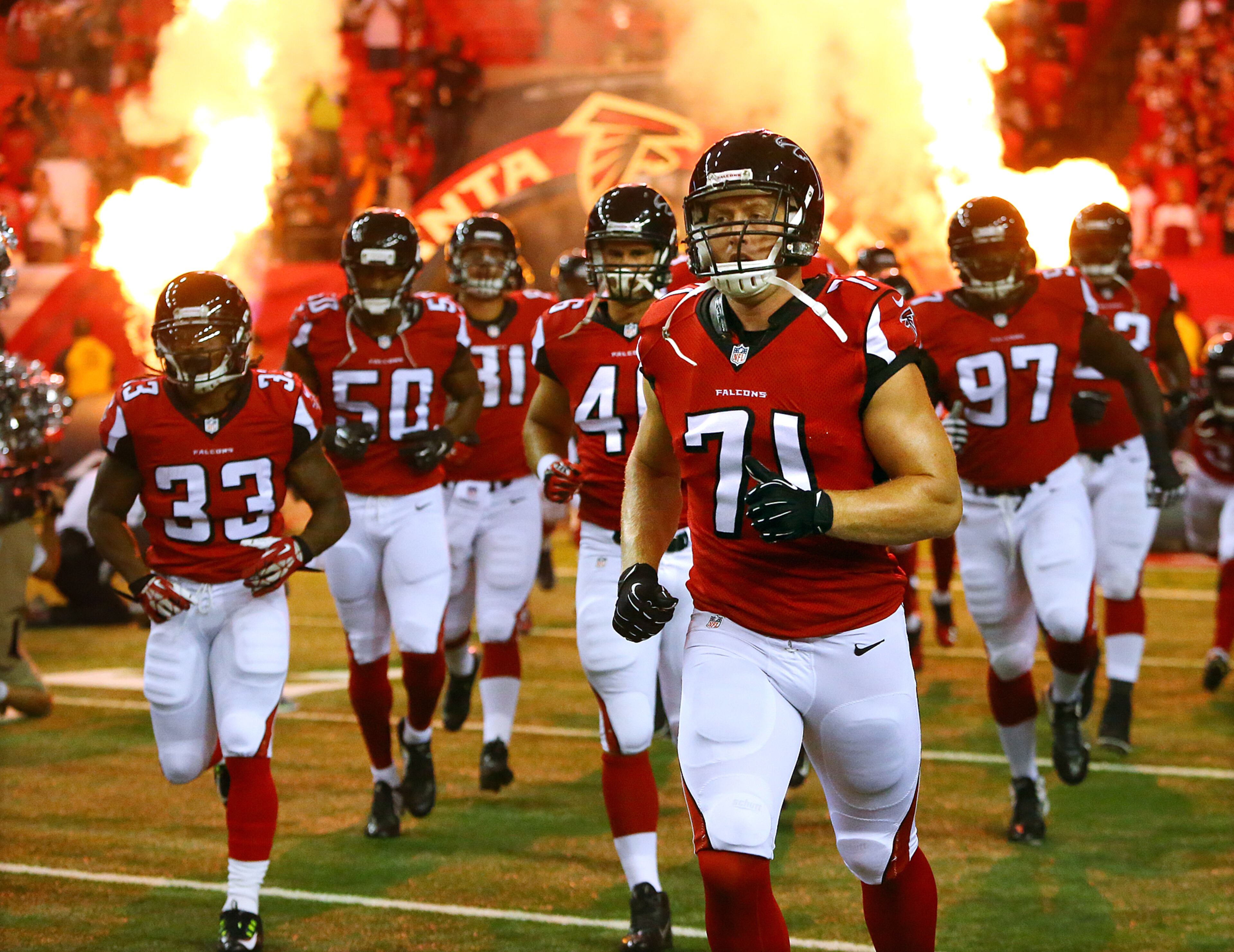 Falcons defensive end Kroy Biermann, coming back from an achilles injury, takes the field with the team against the Miami Dolphins in an NFL exhibition game on Friday, August 8, 2014, in Atlanta.