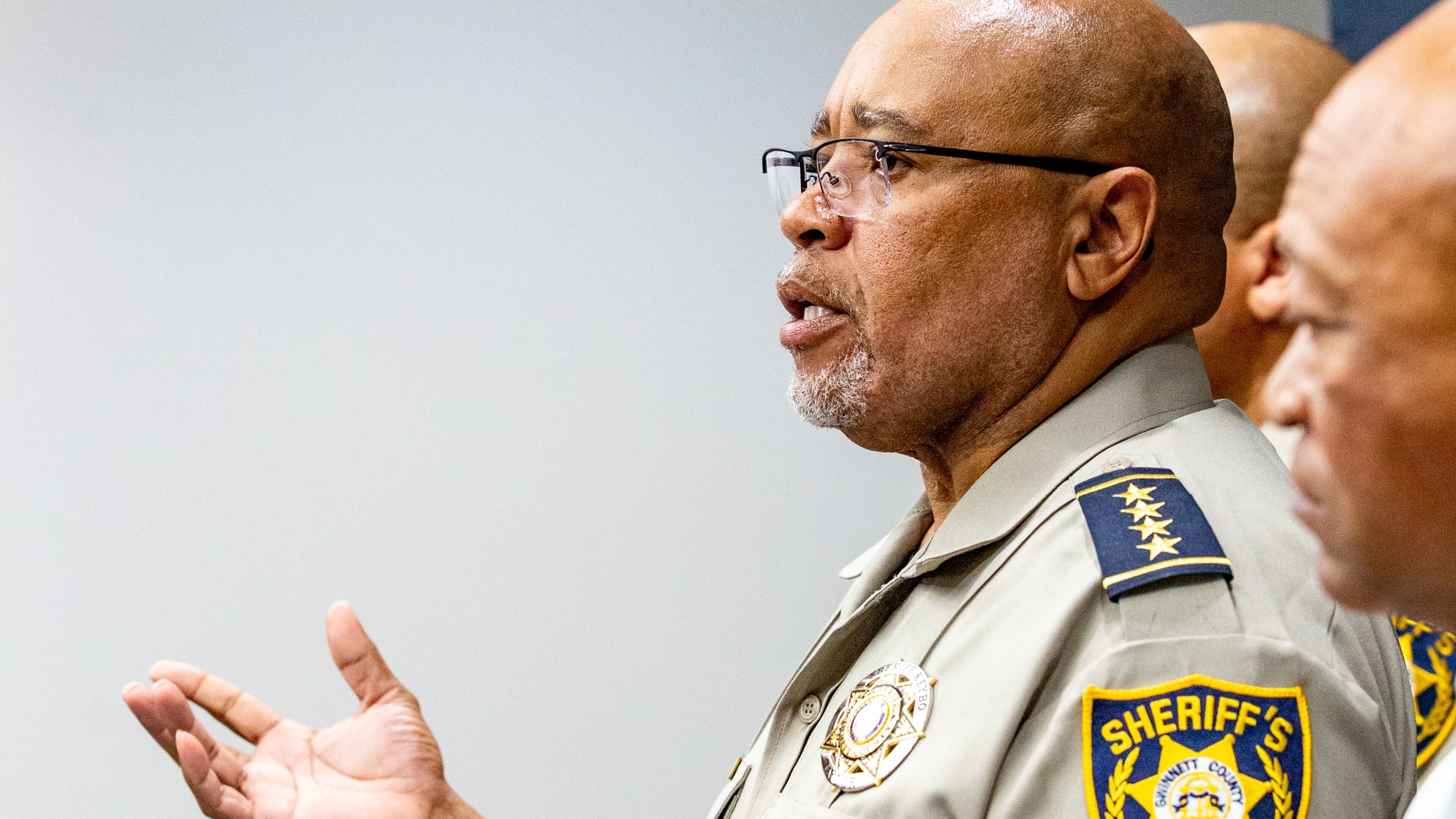Gwinnett County Sheriff Keybo Taylor, left, addresses the press at the Gwinnett Sheriff's Office in Lawrenceville on Tuesday, June 29, 2021. Sheriff Taylor addresses an extortion lawsuit against him initiated by staff at a bail bonds company which has concluded, the bond service has retracted the lawsuit. (Jenni Girtman for The Atlanta Journal-Constitution