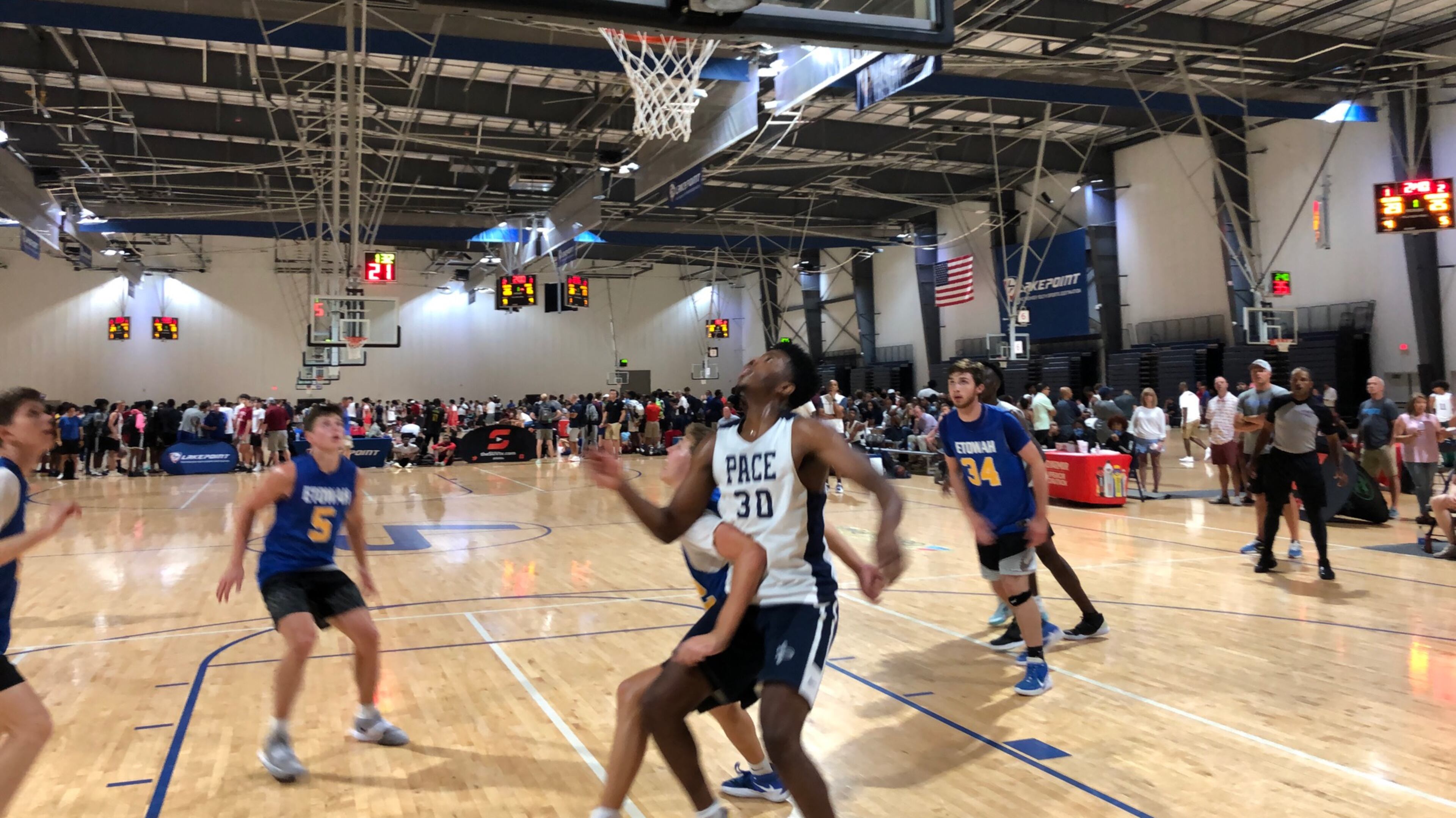 Pace Academy forward Josh Reed (white jersey) positions himself for a rebound in a game at the Georgia Basketball Coaches Association team camp at the LakePoint Sports complex in Emerson on June 18, 2021. (AJC photo by Ken Sugiura)