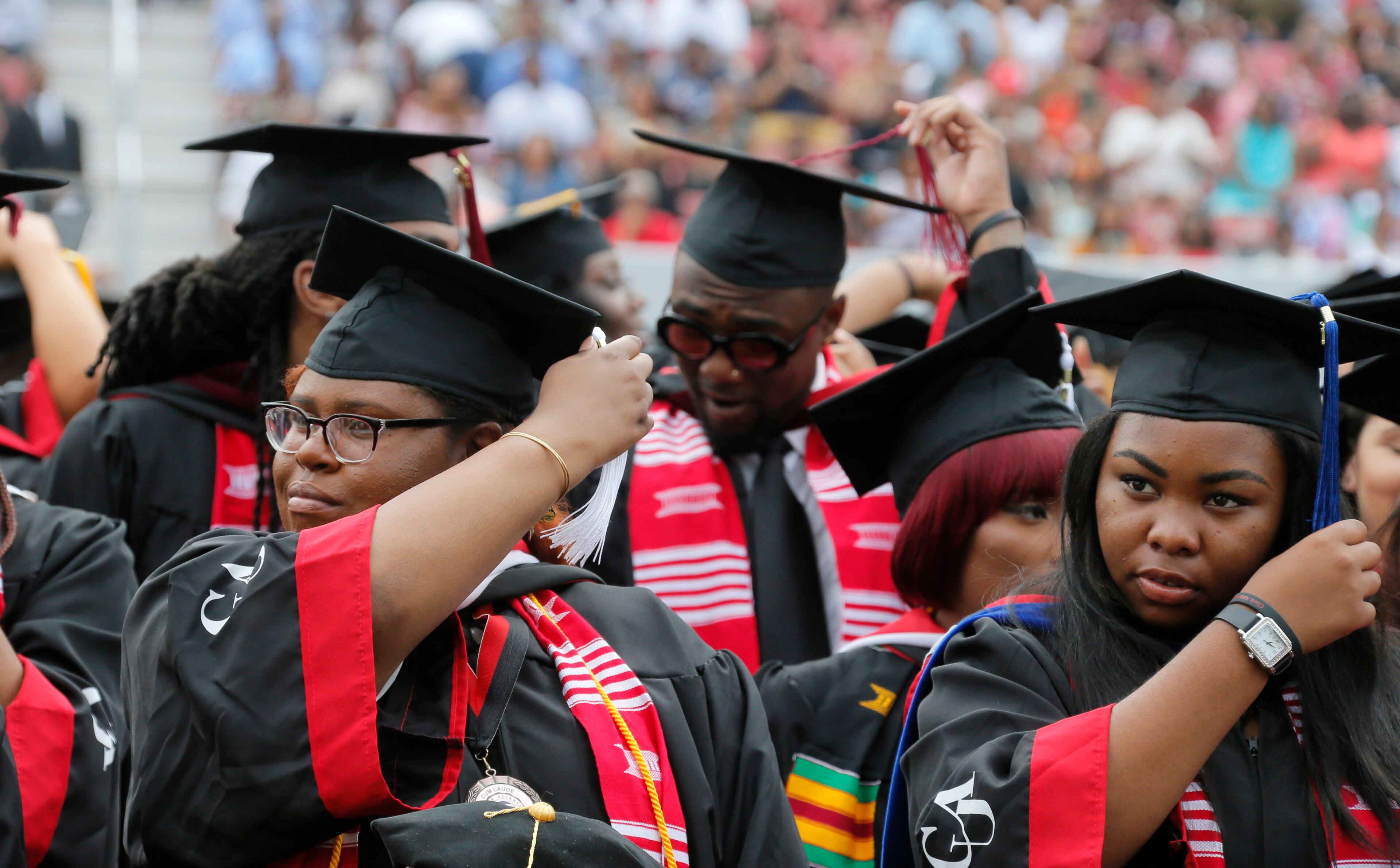 5/22/17 - Atlanta - Graduates turn their tassels as their degrees are conferred. Clark Atlanta University's Panther Stadium was the site of their 28th annual Commencement. Businessman William Pickard gave the commencement address. Rev. Jesse Jackson, who received an honorary degree, also spoke. Panther Stadium, BOB ANDRES /BANDRES@AJC.COM