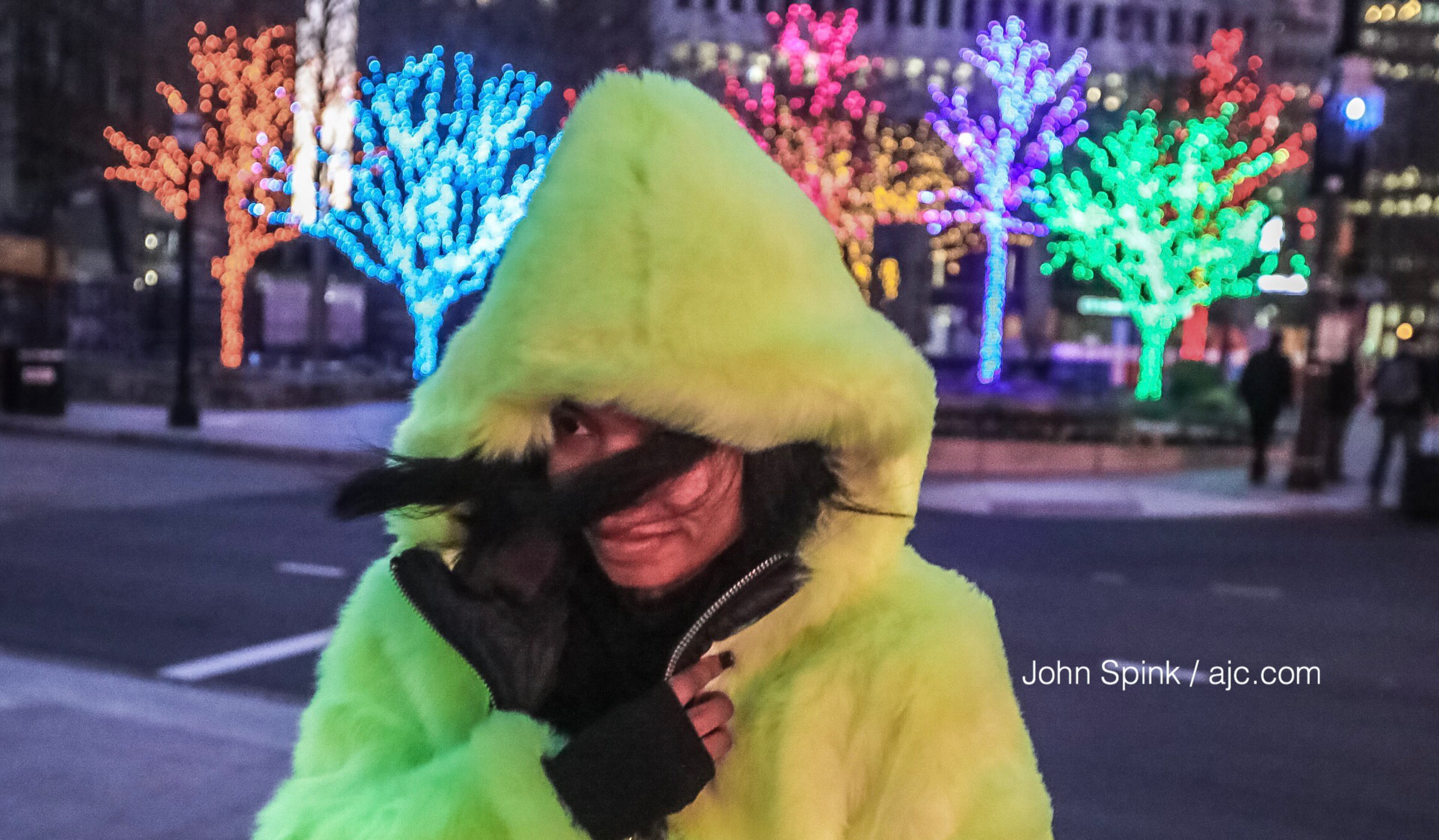 Whitney Teamer braves the cold at 15th and Peachtree streets. Temperatures dipped below freezing in Midtown Wednesday morning. JOHN SPINK / JSPINK@AJC.COM