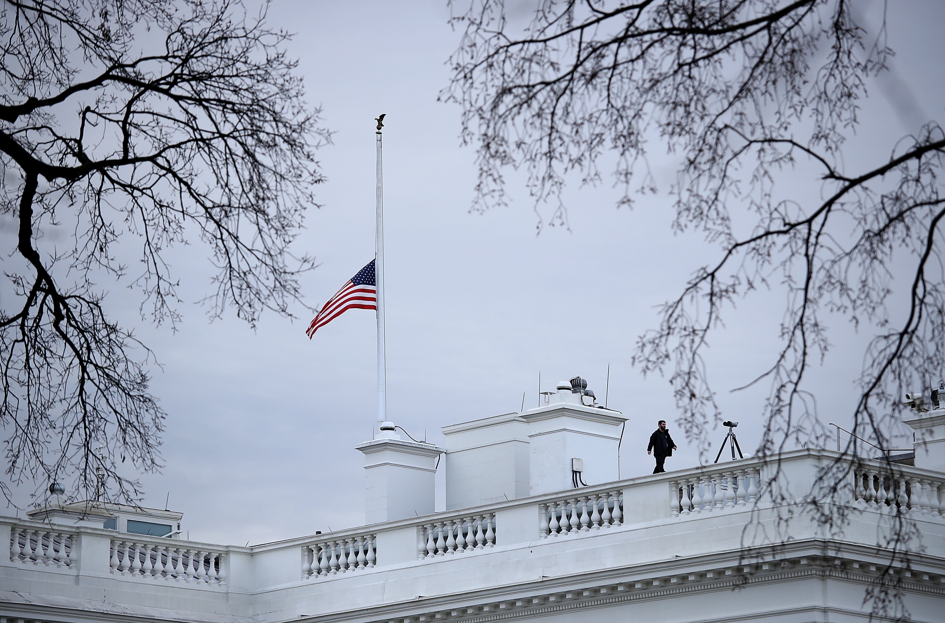 WASHINGTON, DC - FEBRUARY 15: The American flag above the White House is lowered to half staff following the shooting yesterday at Marjory Stoneman Douglas High School on February 15, 2018 in Washington, DC. U.S. President Donald Trump is expected to address the nation later today in response to the shooting in Parkland, Florida where 17 people died. (Photo by Win McNamee/Getty Images)