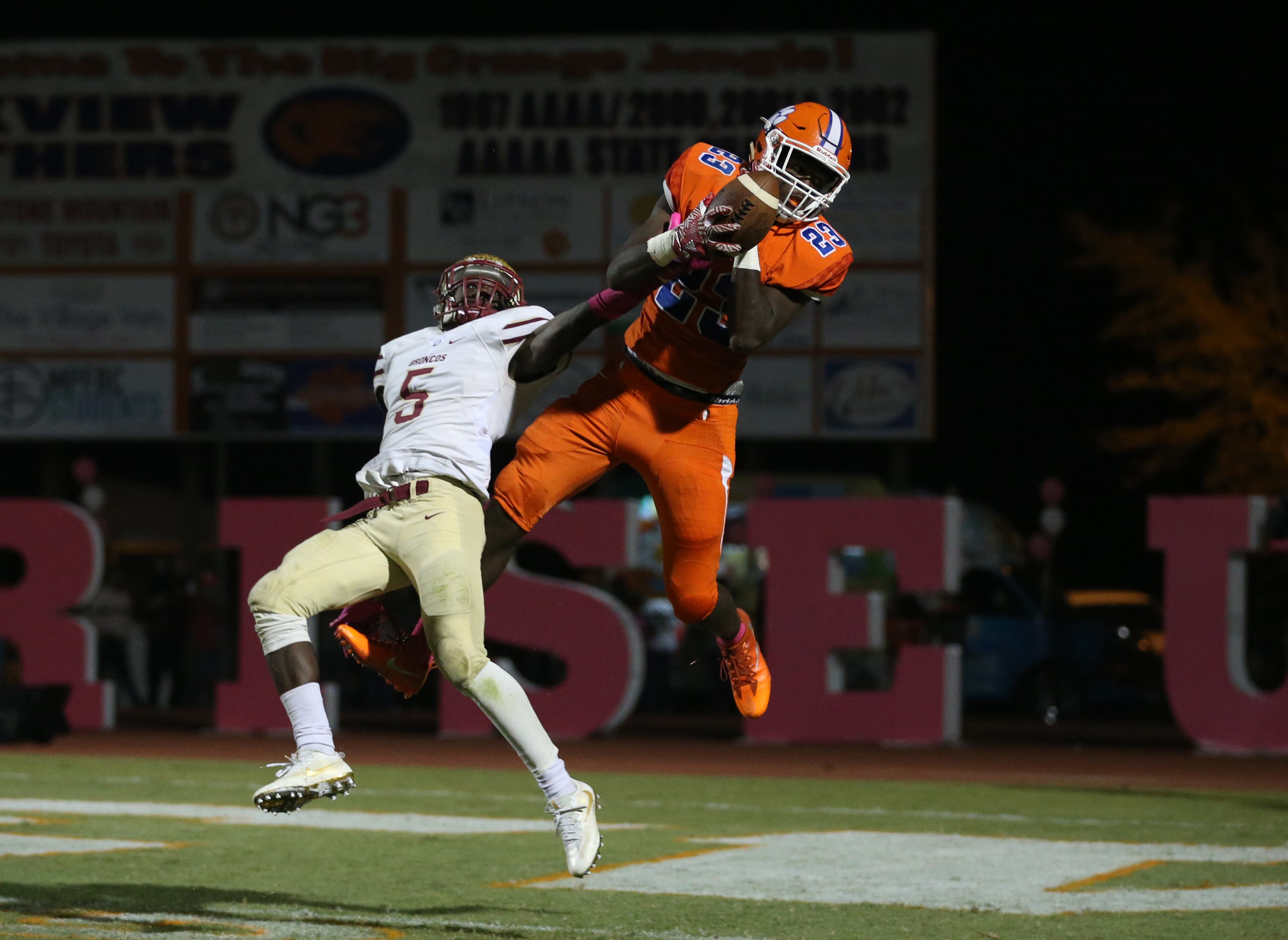 October 20, 2017 - Lilburn, Ga: Parkview wide receiver Miles Marshall (23) catches a touchdown pass against Brookwood defensive back Caleb Riley (5) in the second half of their game at Parkview High School Friday, October 20, 2017, in Lilburn, Ga.. Brookwood won 30-27. PHOTO / JASON GETZ