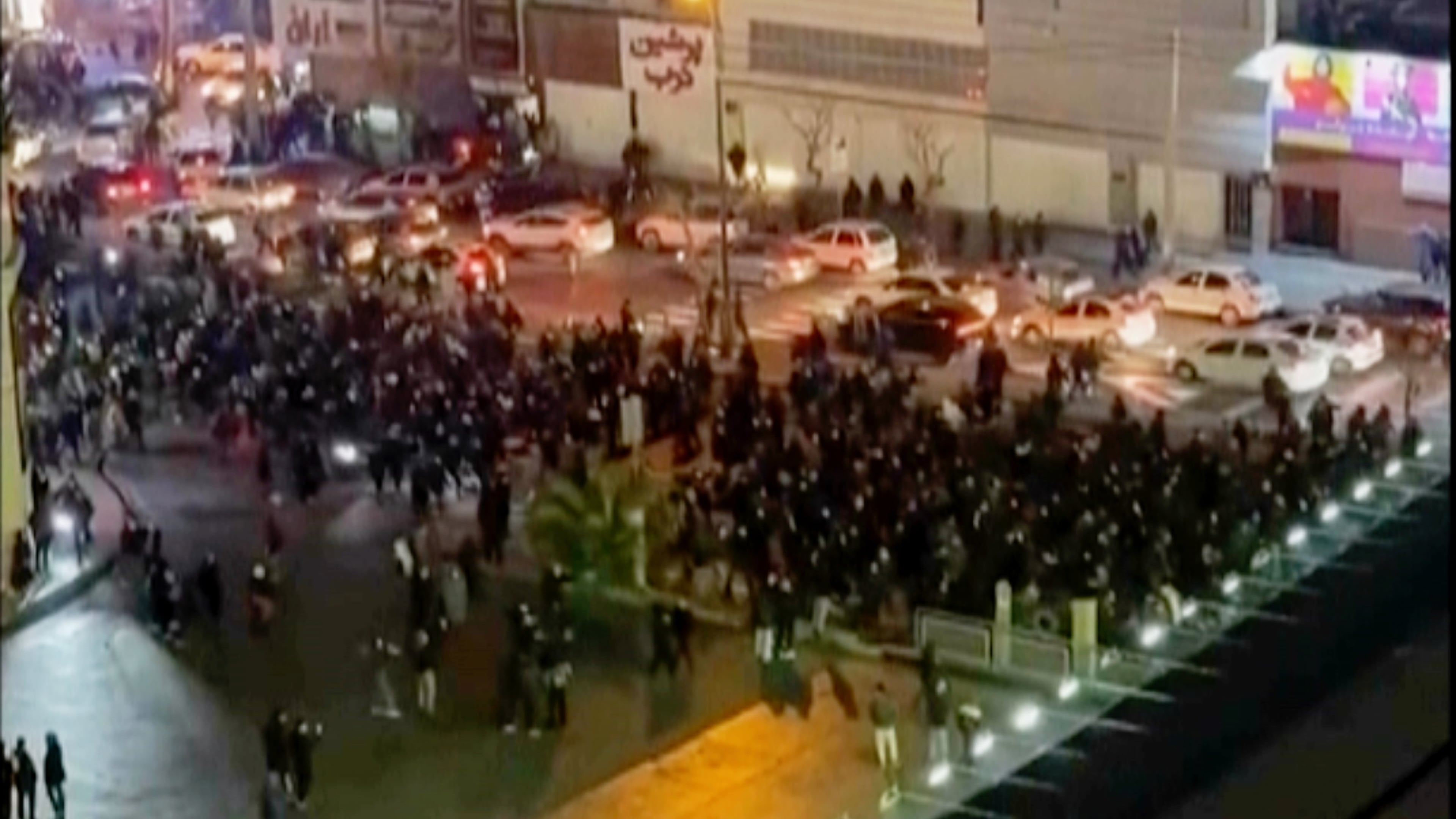 FILE - In this image from video made by an individual not employed by The Associated Press and obtained by the AP outside Iran, people block an intersection during a protest in Tehran, Iran, on Jan. 8, 2026. (UGC via AP, File)