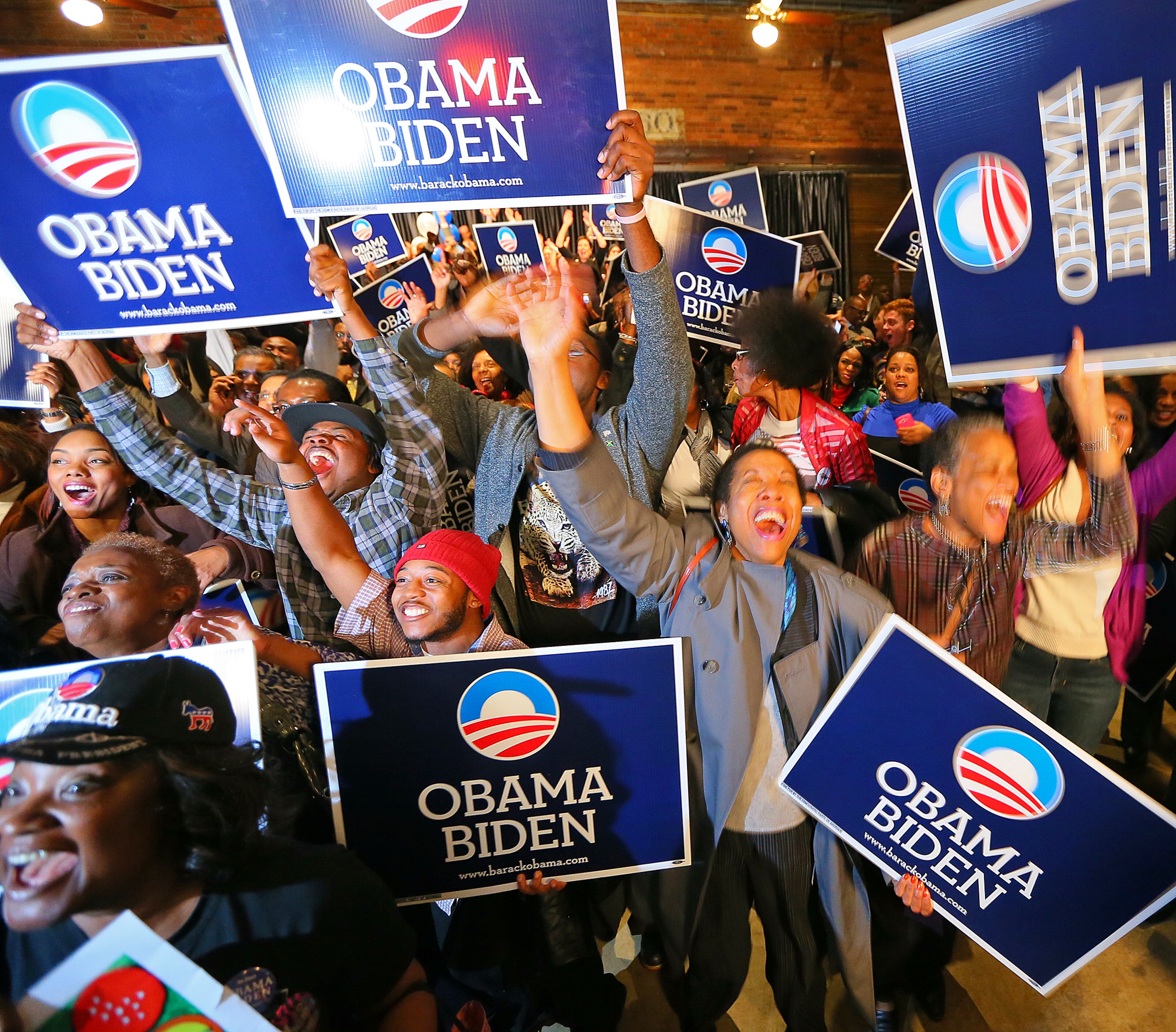 President Obama supporters erupt in celebration after President Obama wins re-election at the Democratic Party of Georgia election party at The Depot in Atlanta Tuesday, Nov. 6, 2012.