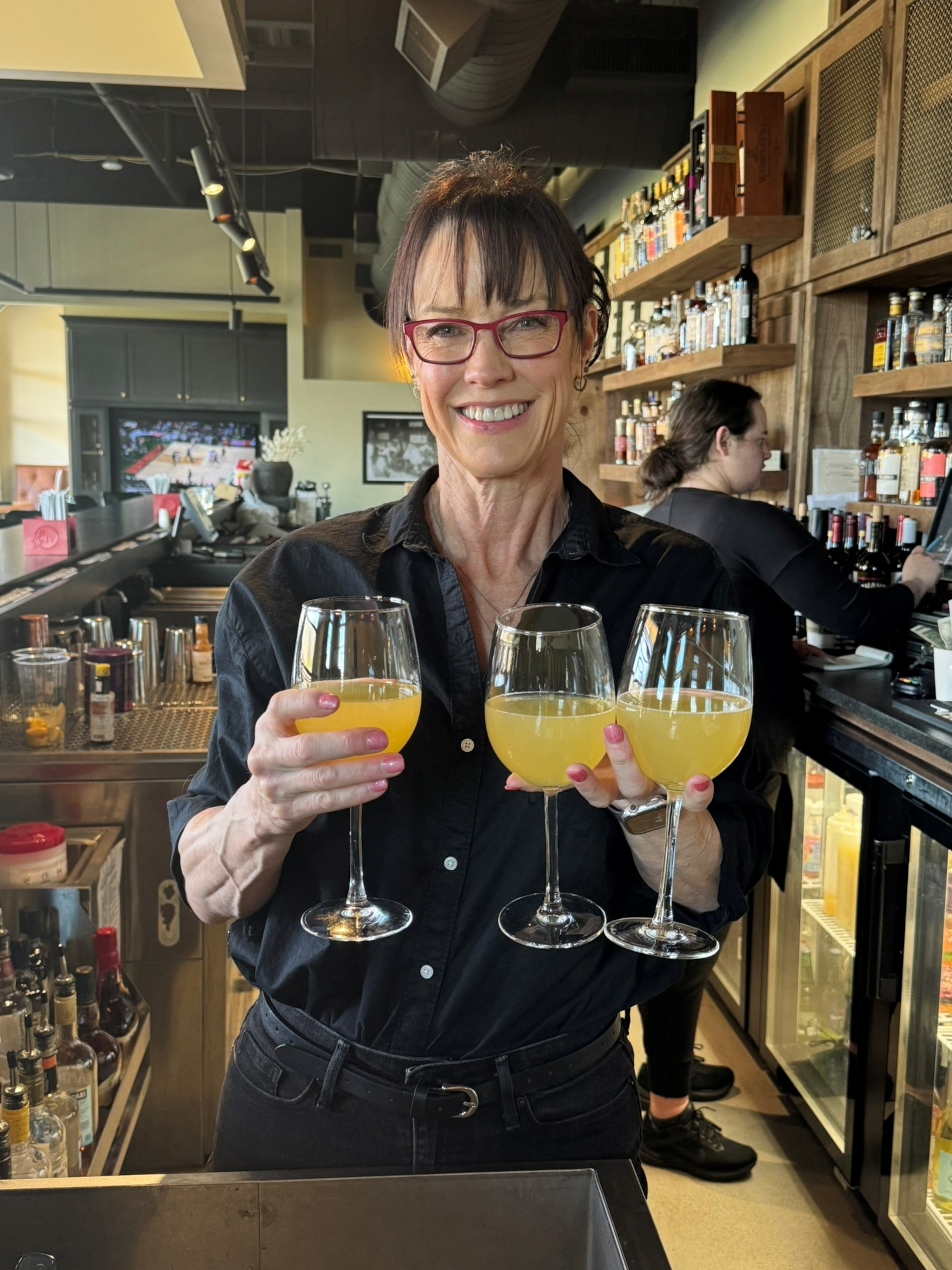 Beth Minor, 60, returned to her "hospitality roots" as a bartender at Rosati's Pizza at Cumming City Center while searching for her next full-time career move. (Courtesy of Beth Minor)