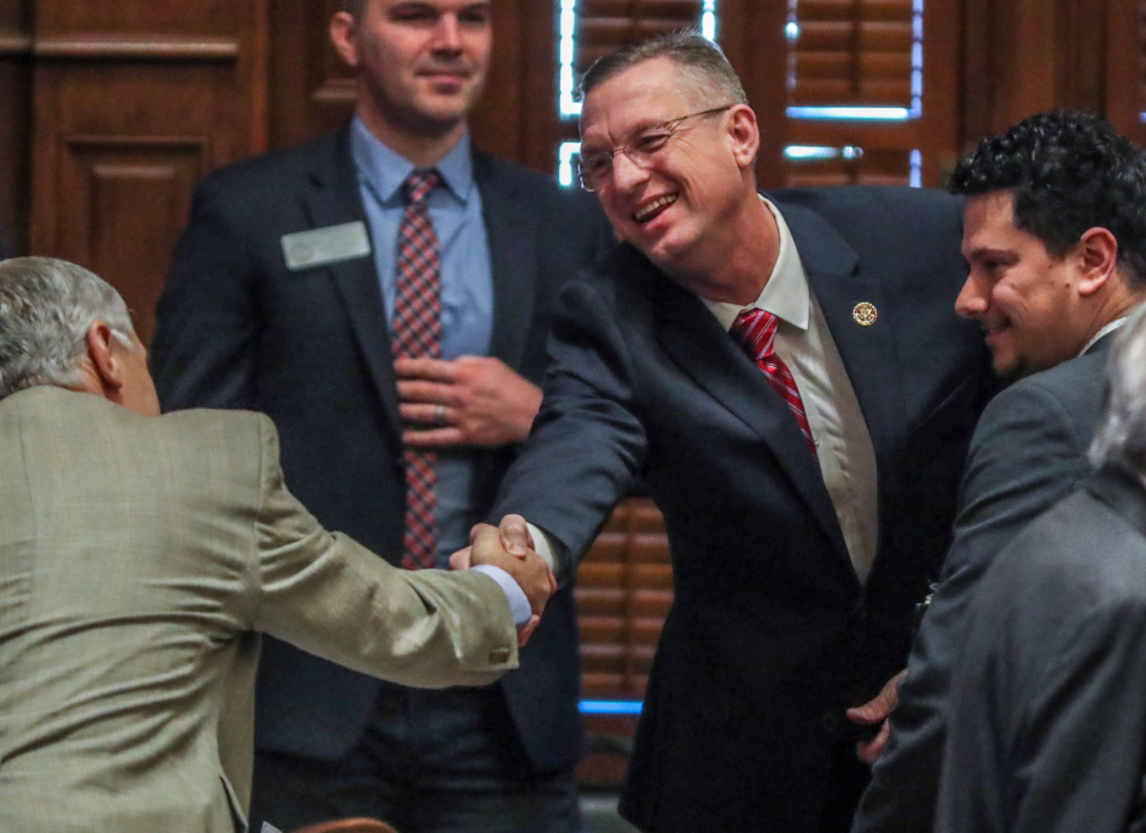 January 28, 2020 Atlanta: U.S. Rep. Doug Collins (center) shakes hands with members of the House before he addressed the Georgia House on Tuesday, Jan. 28, 2020 as its Chaplin of the day. This coming just hours after news broke that Collins is preparing to challenge U.S. Sen. Kelly Loeffler, and avoided any mention of seeking a higher office. In his sermon and closing prayer, Collins honored Rep. Jay Powell, the House Rules Committee chairman who died in November and who Collins described as a mentor. Speaker David Ralston signaled his support of the soon-to-be senate candidate, stopping short of an explicit endorsement. Collins and Ralston have a strong relationship dating back to their time as state house colleagues; Collins voted for Ralston’s speakership while deployed in Iraq. “He is my friend. He has stood by me when few would,†Ralston said.â€And I don’t forget things like that.†JOHN SPINK/JSPINK@AJC.COM