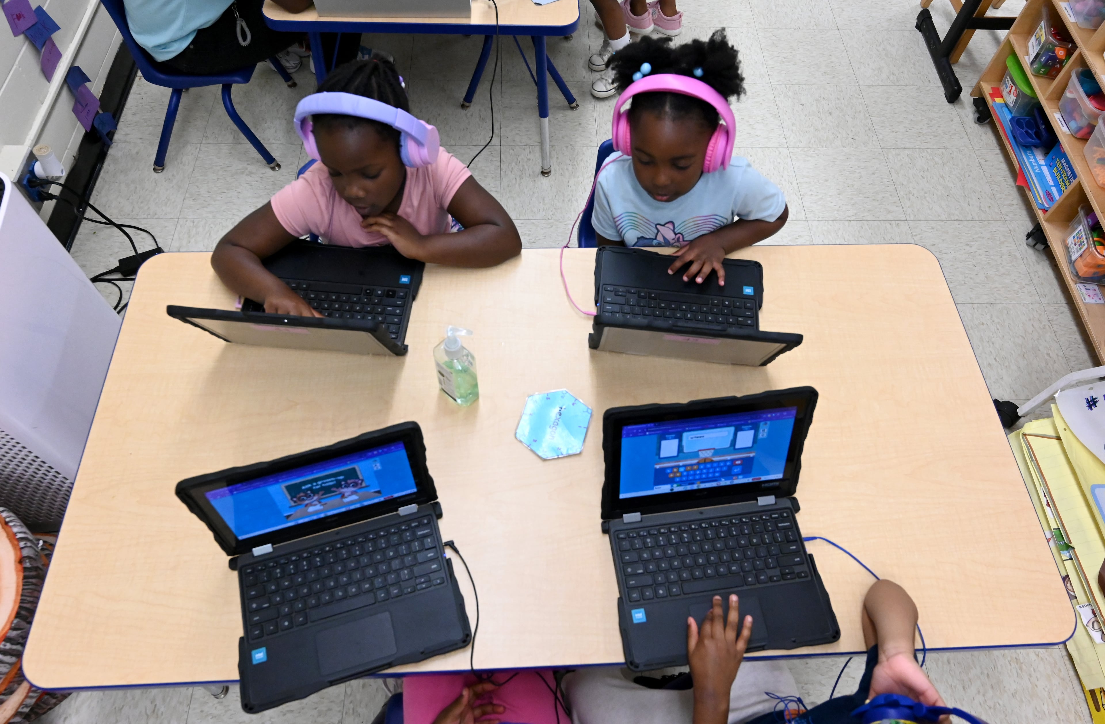 Pre-K students work on laptops during the 2026 school year. (Hyosub Shin/AJC)
