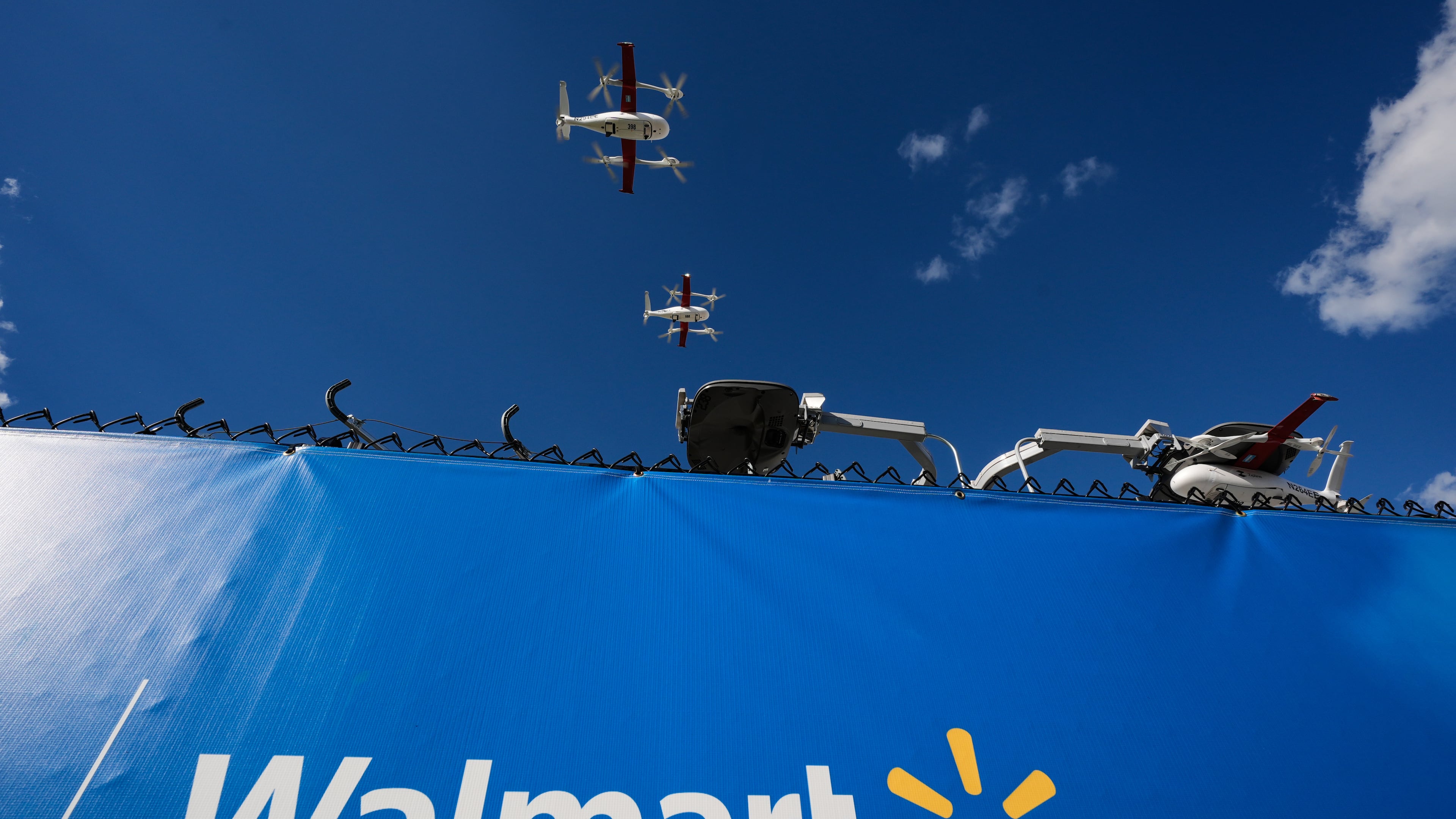 Drones operated by Zipline leave base to make deliveries from a Walmart store in Pea Ridge, Ark., Friday, Sept. 26, 2025. (AP Photo/Charlie Riedel)