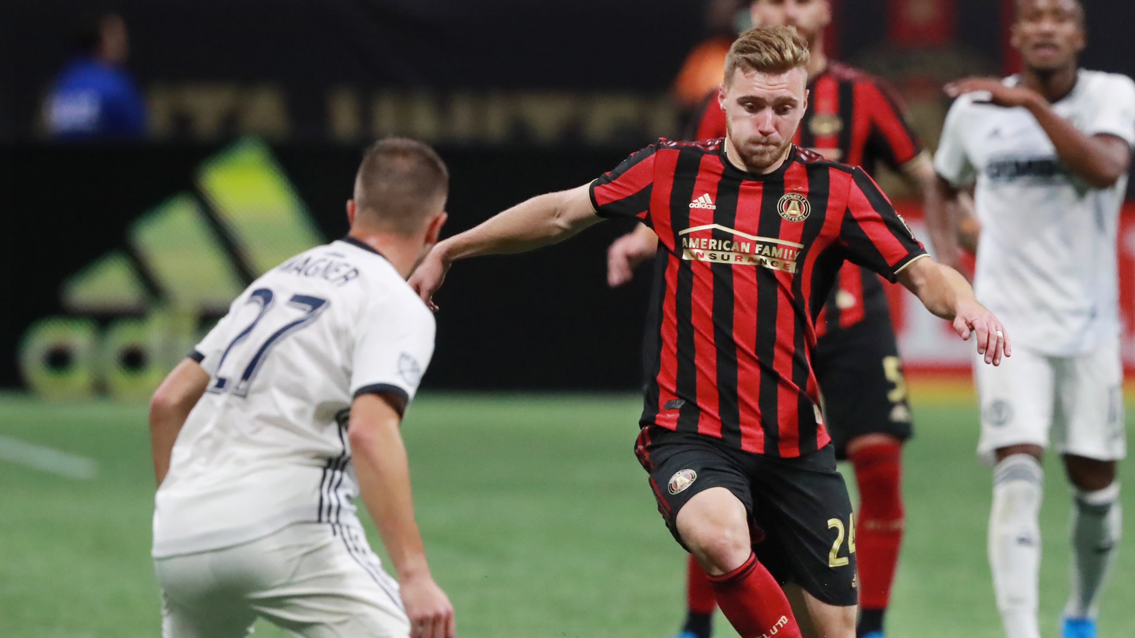 October 24, 2019 Atlanta: Atlanta United midfielder Julian Gressel passes the ball around Philadelphia defender Kai Wagner in the Eastern Conference semifinals of the MLS playoffs on Thursday, October 24, 2019, in Atlanta. Curtis Compton/ccompton@ajc.com