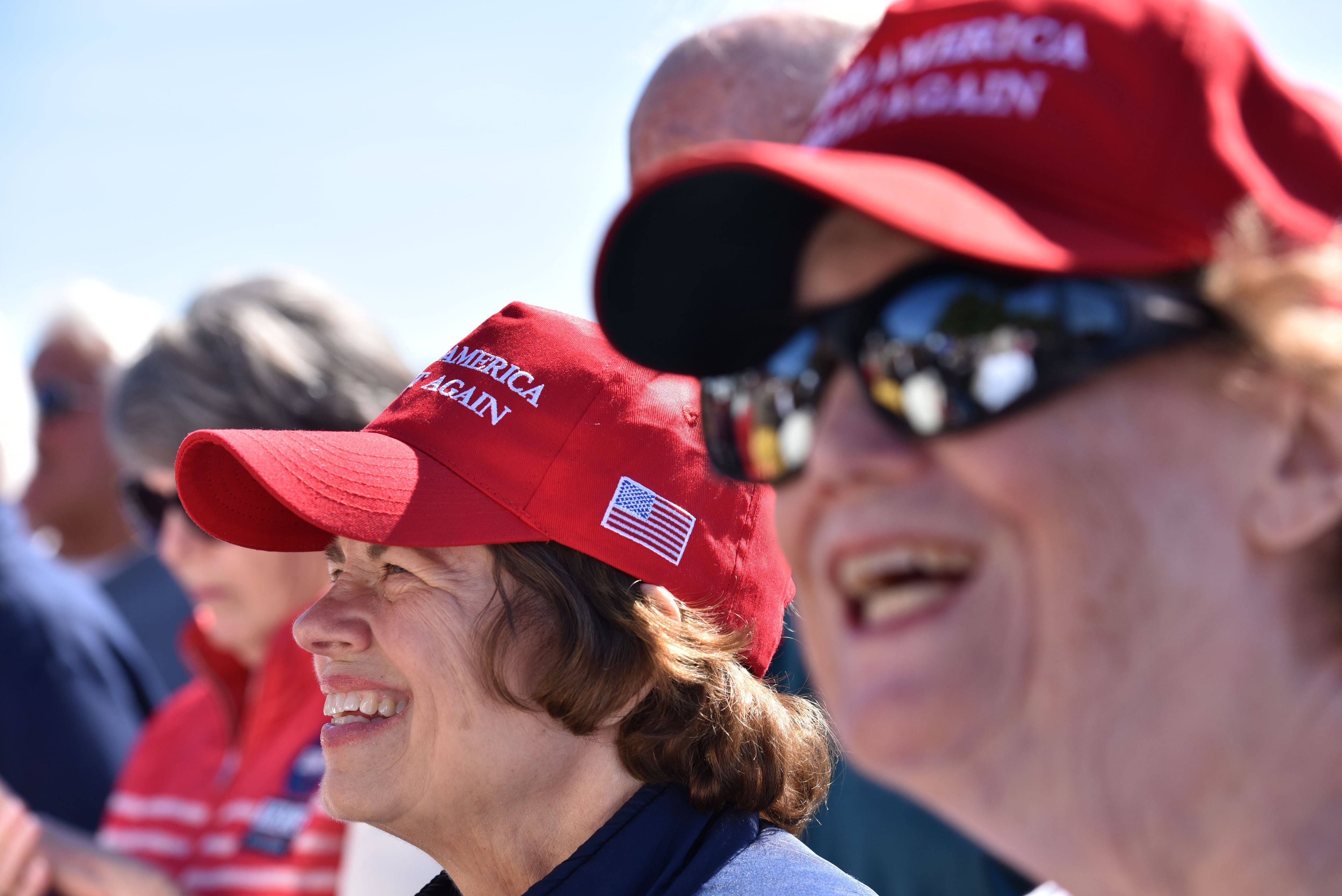 October 30, 2018 Cumming - Supporters react as GOP gubernatorial candidate Brian Kemp speaks at corner of Highway 9 and Buford Dam Road in Cumming on Tuesday, October 30, 2018. Brian Kemp's stops in Cumming and Woodstock attracted hundreds of voters. Democrats have put a bullseye on the close-in suburbs, which were once solidly conservative but transformed into swingier territory with Donald Trumpâs victory. HYOSUB SHIN / HSHIN@AJC.COM